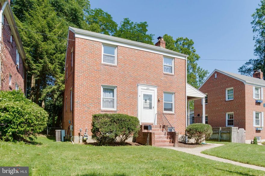 Solid, brick home with refinished HW floors, Most rooms freshly painted. Lg side porch off LR plus extended kitchen area, full bath & bedroom or family room or even home office on 1st level. Semi finished basement area. Large deck off breakfast room. Convenient location to shopping, public transportation. A stones throw to Mt De Sales Academy. Ready for immediate possession. Back on market due to buyer unable to obtain financing