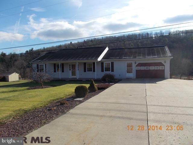 Centrally located sprawling Rancher on 1 Acre, only 13 minutes to downtown Bellefonte & 11 quick minutes to Penn State University. True 1 level living at it's finest, this well-maintained home delivers a spacious living room, well-appointed eat-in kitchen with hardwood floors & slider to deck, 1st floor laundry room, master bedroom with it's own private full bath, 2 additional bedrooms & another full bath. The partially finished walk-out lower level delivers plenty of natural light, a family room with wet bar & cozy fireplace, half bath & a large workshop area with an overhead door to back yard perfect for lawnmower storage. Additional highlights include an attached oversized 1 car garage, oil forced air heat, Harmon stove & plenty of closet/storage space. Country setting with beautiful views & a quick easy commute.