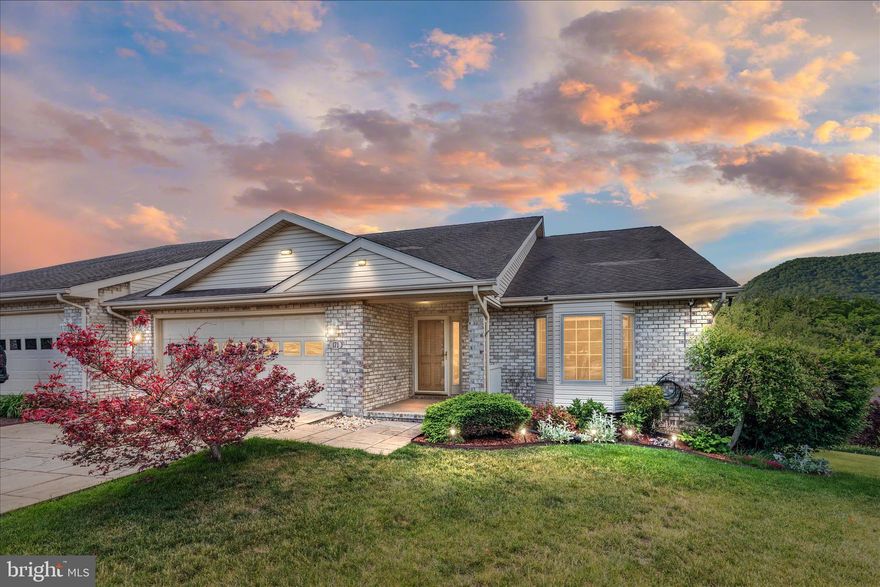 Welcome to this beautifully maintained 4 bedroom, 3 bathroom brick duplex with a basement located in the sought-after Stony Pointe community, offering stunning mountain views and numerous quality upgrades throughout.

Freshly painted and move-in ready, this home features duct cleaning completed in 2026, a new stainless steel refrigerator, new dishwasher, Healthy Climate air cleaner and humidifier integrated with the HVAC system, central vacuum, updated lighting and mirrors, and a two-car garage.

The main living areas showcase gorgeous hardwood flooring, while the spacious living and dining room offers a natural gas fireplace with mantel and transom windows for added charm and natural light. The kitchen is highlighted by Corian countertops, crown molding, and a bright bay window dining area. An entry-level bedroom for added convenience.

Retreat to the spacious primary ensuite featuring a double vanity, jacuzzi tub, stand-up shower, and walk-in closet. Two additional bedrooms are also located on the main level.  The lower level includes an additional bedroom with walk-in closet, full bathroom, large rec room, unfinished storage and utility area, and endless possibilities for additional living space.

Outdoor living is equally impressive with an enclosed sun porch featuring Trex flooring and magnificent mountain views, covered patio, outdoor storage shed, stamped concrete driveway, covered front porch, and attractive stone steps and walkway in the rear. A dedicated 50-amp fuse on the lower patio, previously used for a hot tub, could also accommodate a future outdoor kitchen setup.

Conveniently located just minutes from downtown Strasburg, shopping, dining, and major commuter routes, this exceptional property combines comfort, convenience, and scenic Shenandoah Valley living.