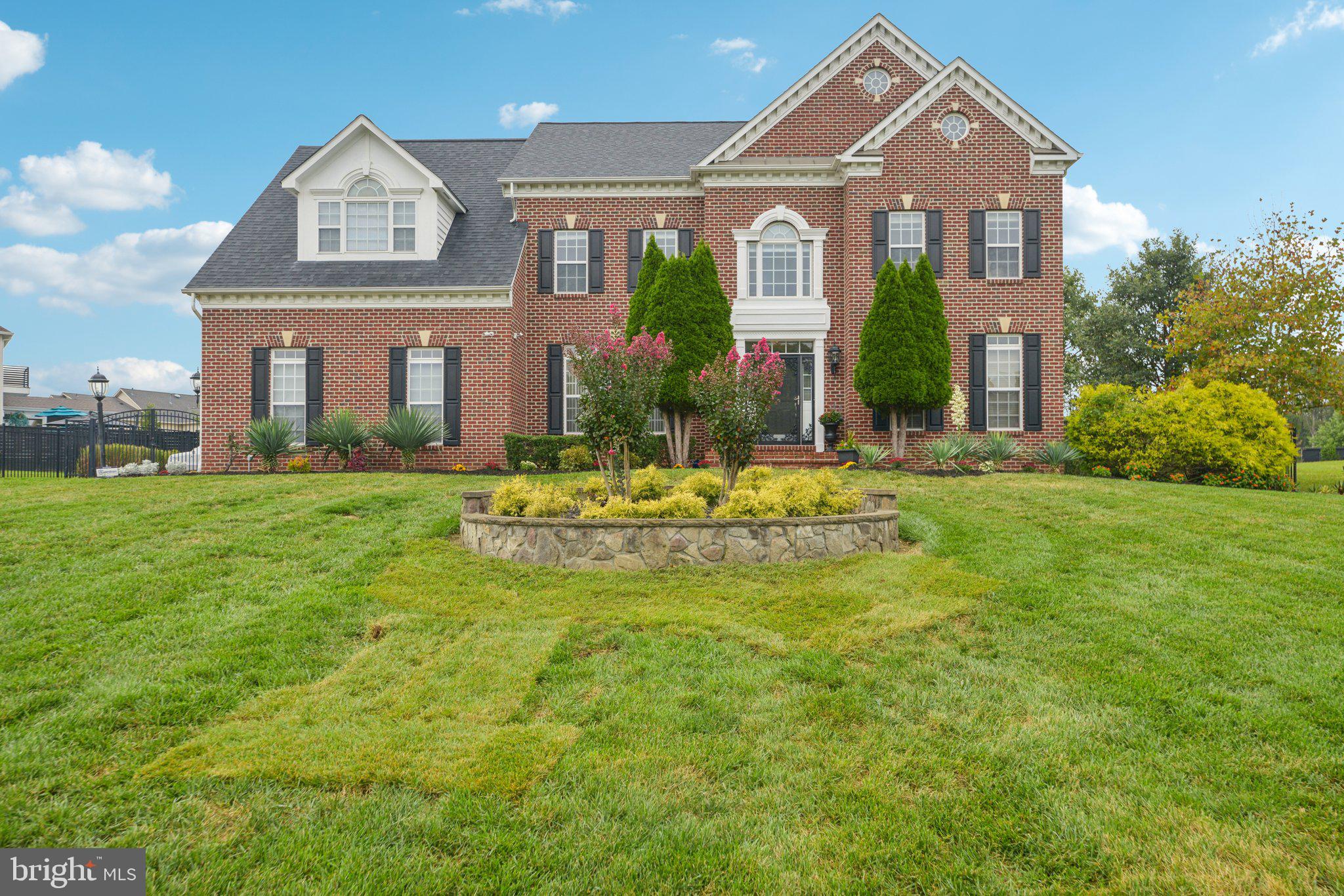 Step into the perfect blend of elegance, comfort, and entertainment in this stunning Woodmore North estate. Featuring 4 spacious bedrooms and 4.5 baths, this home is thoughtfully designed for modern living and unforgettable gatherings.
The upper level boasts a luxurious primary suite with vaulted ceilings, a wet bar, and custom walk-in closet systems. The spa-inspired bathroom features dual vanities, a soaking jacuzzi tub, separate shower, and private water closet. Two additional bedrooms share a well-appointed Jack and Jill bathroom, while the fourth bedroom boasts its own private-in-law suite bath, providing comfort and privacy for family and guests alike.
The main living areas are superb for relaxing or entertaining. A gourmet kitchen with high-end stainless-steel appliances opens to a family room with a fireplace, formal living and dining rooms. The sunroom is filled with natural lighting and lead to an elegant stone outdoor patio with grill, tv which is surrounded with lights that is perfect for quiet and relaxation. In addition, a dedicated library space completes the main living area. The home is beautifully enclosed with a six-foot black aluminum fence and dual fourteen-foot arch gates, ensuring privacy and peace of mind for children, pets, or outdoor living. The basement is an entertainer’s dream, featuring a marble bar, full kitchen, pool table, pub table, full bath, and unfinished space ready to be customized into a home theater, guest suite or office. Step outside into your backyard oasis, where luxury meets nature. The open-air cathedral pavilion lights up the oasis with lighted pillars, and ceiling fans. A two-
sided stone masonry fireplace heats up the stunning outdoor pavilion. The pavilion includes multiple bars, kitchen equipped with grills, refrigerators and televisions. On the other side of the pavilion there is a sophisticated area in front of the fireplace that creates a warm and inviting setting for entertainment or relaxation. A soaking jacuzzi tub nestled in a private gazebo, a firepit, perfect for cozy evenings with friends and family. Surround yourself with fruit-bearing trees including grape, pear, apple, fig, pomegranate, blackberry, and peach. Four outdoor televisions ensure year- round entertainment, and a 20x12 storage shed offers ample space for all your outdoor gear.
Additional features include a two-car side-load garage with epoxy flooring and driveway parking for up to six vehicles. Every corner of this home is designed for living, entertaining, and creating memories. With its combination of luxury interiors, versatile spaces, and a backyard retreat like no other, this property is a rare
opportunity for discerning buyers. Don’t miss your chance to call this one-of-a-kind estate home yours.