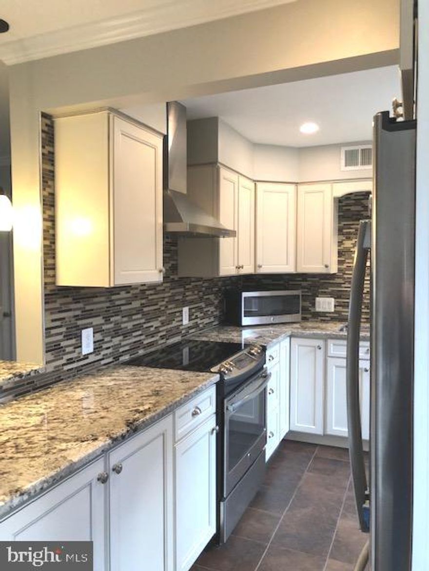 Owner renovated this dazzler for daughter.  Need I say more?
All the best and perfect in every way.
Wood burning fireplace.  Top quality large kitchen open to Living Rm. with counter and stools.  Granite counters, stainless appliances,  French-Door-Refrigerator/Freezer, abundant counters and cabinets.  Top quality Bath with handsome wainscotting, updated shower head and good storage.  In-unit Washer and Dryer.  Wood flooring in Living Rm.  Tile in Dining Area and Kitchen.  Carpet and ceiling fans in both Bedrooms.   Rent includes hot water.   Tenant pays electricity; HVAC is electric heat pump - averages $80.00-$110.00 per month.  Extra storage in Bldg. 2603 - #79.  Exceptionally responsive local landlord.  Per landlord no smoking and no pets.  No exceptions. Don't ask.