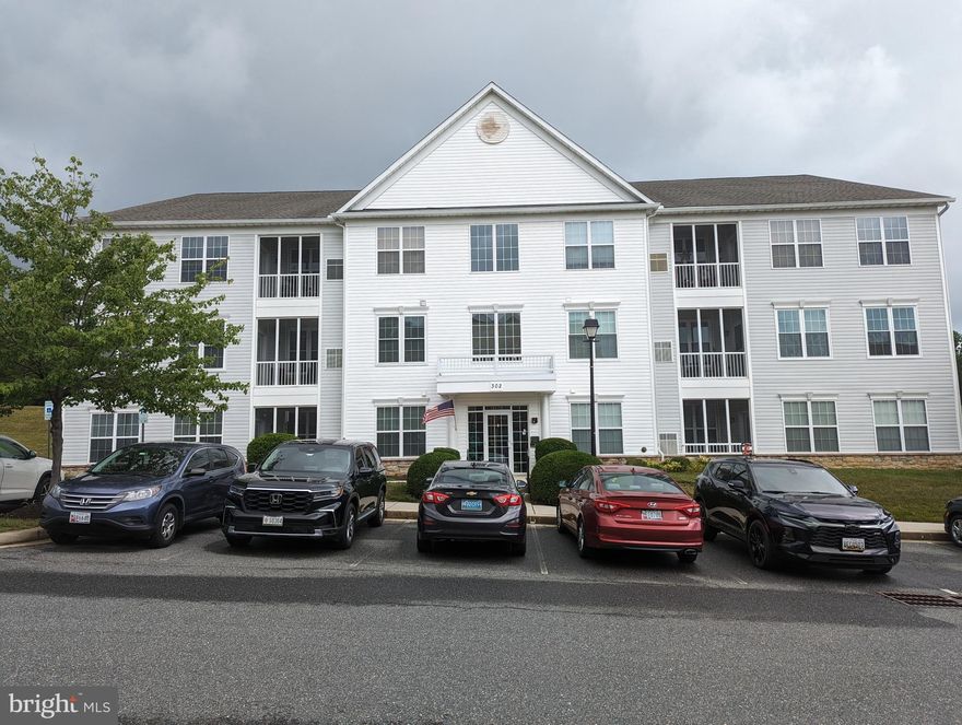 Rarely available move-in ready Condominium in sought-after Monmouth Meadows.  This is a spacious first floor unit in an elevator building being sold by the original owner.  It is a very spacious 2 bedroom unit with a gourmet Country Kitchen. The country kitchen opens to a breakfast area and a den.  There are also separate living and dining rooms.   There are 2 nice bedrooms and 2 full baths.   There is ample storage in closets and the utility room.   The screened porch is a wonderful area to relax.  Furniture is available for purchase.  This wonderful unit won't last long, so schedule your personal tour now!