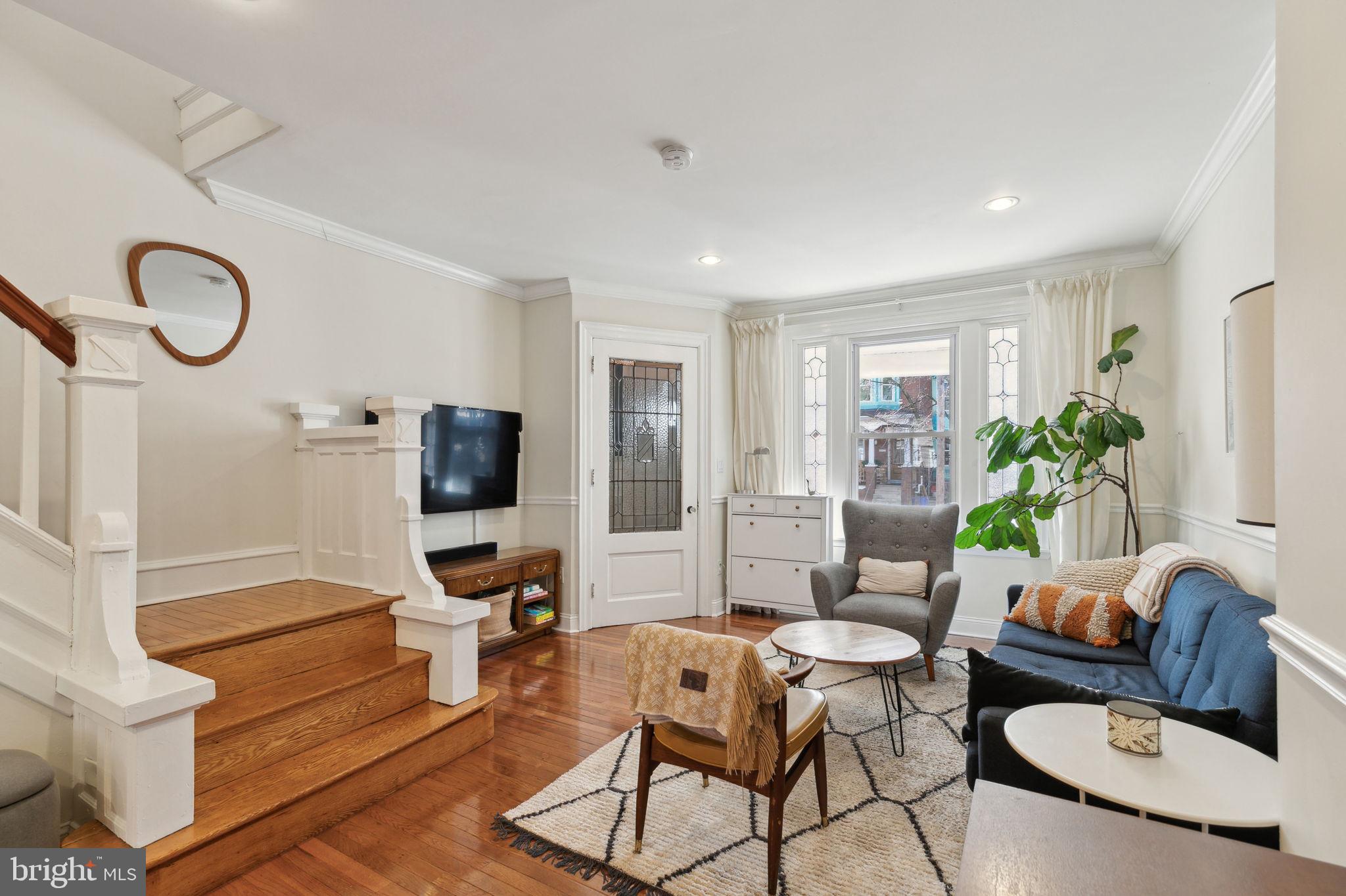 Offer Deadline: Monday (3/3) at 11 am
Welcome to 5339 Walton Ave! This charming 3-bedroom, 1.5-bath home is south-facing and filled with abundant natural light. Enter through the covered porch and vestibule, leading into the spacious first floor with high ceilings, hardwood floors, and charming original details, including a handsome staircase. The open living, dining, and kitchen areas are perfect for entertaining and have a mudroom leading out to the large rear yard.
Upstairs, the primary bedroom at the front of the house boasts plenty of light, custom closets, and a cozy bookshelf nook. The shared hall bath features a tub with a tiled shower, a skylight, and a new vanity. The other two bedrooms are good-sized, each with closets and original hardwood floors with beautiful inlays.
The finished basement provides bonus space for a home office, playroom, storage, and laundry, plus a convenient half bath. Enjoy urban living with your own native garden out front, offering a peaceful green space. This home is within walking distance of neighborhood favorites, including Vietnam Cafe, The Gold Standard Cafe, Loco Pez, Malcolm X Park, the Baltimore Ave trolley, the Market Street Line, and so much more. Schedule your appointment for a private tour today!