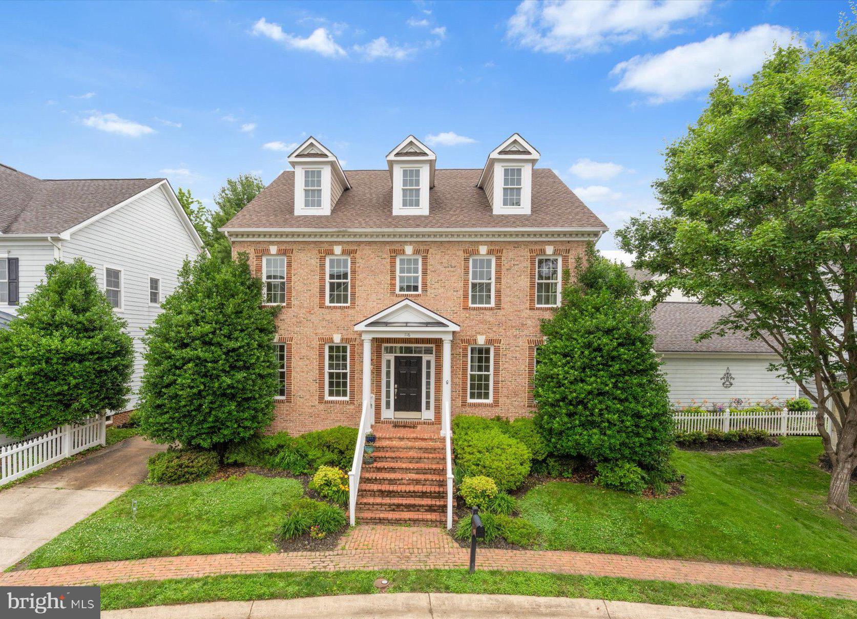 Welcome to 116 DeSales Drive! You'll love the park-like setting in the sought after Courts of St. Francis. This brick front with Hardi plank siding over 3,000 square feet home with an open kitchen and family room layout - perfect for everyday living and entertaining. The kitchen features a big island with granite counters, custom painted cabinets and designer backsplash, and a spacious butler's pantry. Cozy up in the family room by the gas fireplace and enjoy. Hardwood floors throughout the main level. Upstairs the primary suite offers a luxury bath and walk-in closet. Plus, you will find three more bedrooms, a second full bath and a laundry room. The lower level is a blank canvas just waiting for your ideas - cozy movie nights, a fun game room or workout space.....the possibilities are endless! Step outside to a fenced yard with mature landscaping, a brick walkway, and a private patio surrounded by gardens. You are a short distance to Downtown Purcellville - local shops, restaurants, breweries, parades and even the W&OD Trail are nearby. Love where you live!