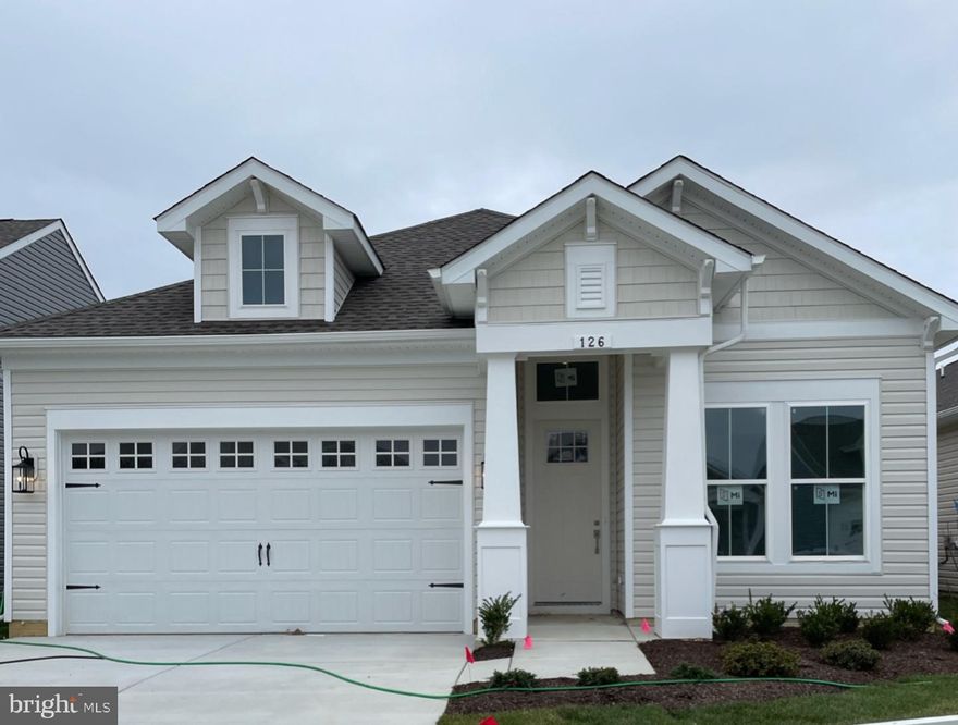 Great detached option for 55+--beautiful community with water access, screened porch, HIGH ceilings, primary suite with two separate vanities, home office, second bedroom with full bath in hall. This home is built for comfortable living and entertaining--kitchen flows into a dining area in one direction and a great room with fireplace in the other.