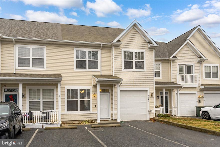 This attractive townhouse is located in one of the area’s most sought-after communities. This home offers a prime location surrounded by extensive neighborhood amenities and convenient access to local attractions. The main level features a spacious, open living area and a well-appointed kitchen with direct access to the rear patio—ideal for outdoor dining or relaxing. The garage includes built-in storage, and the home offers exceptional additional storage options, including space under the stairs for seasonal items and a floored attic for even more versatility. The upper level includes a primary suite with a walk-in closet and private bath, along with a conveniently located second-floor laundry room near all bedrooms. The thoughtful layout provides comfort and flexibility for a variety of lifestyles. Residents enjoy access to community amenities, including a clubhouse, pool, fitness center, and tot lot. The location is a standout—just minutes from the Town of Berlin, Ocean City beaches and boardwalk, and Assateague Island. This is a wonderful opportunity to own a home in a vibrant and amenity-rich community close to everything the area has to offer.