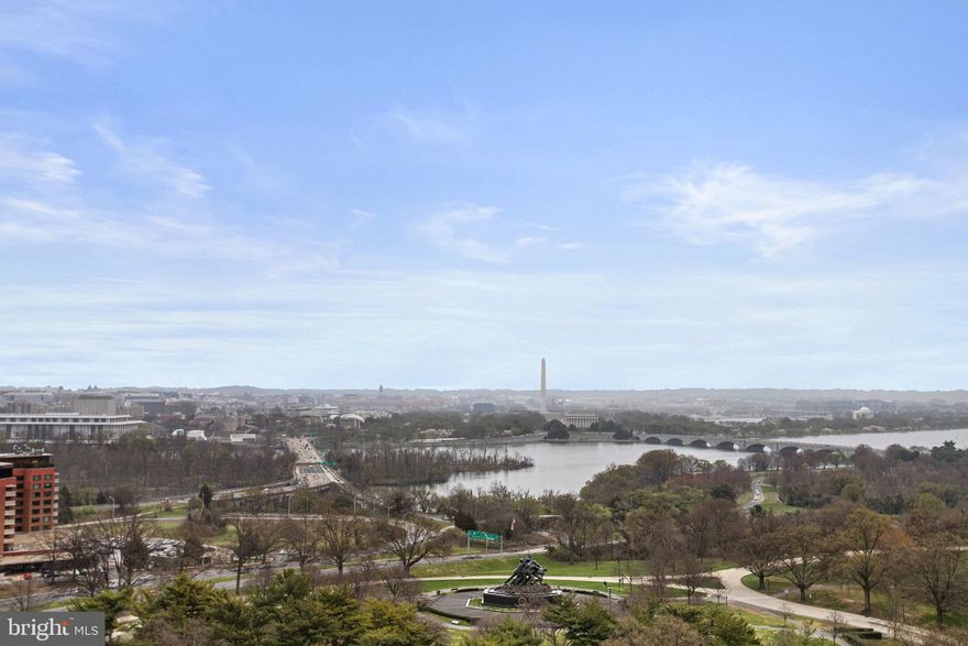 Rarely available sky home with the best views of DC!  Unit 907 provides an unparalleled perspective of the DC skyline with unobstructed views of the Capitol, monuments and the Potomac River.  This two bedroom, two and a half bath has a sleek, modern feel with a  renovated gourmet kitchen and beautifully renovated bathrooms.  A full wall of windows with sliding glass door opens to the spacious balcony with the best views of DC.  The beautiful curved staircase leads to an open floor plan that features a  living room with custom built-ins and a wood burning fireplace, dining room, and a kitchen with granite countertops and stainless steel appliances.  The primary bedroom has an ensuite renovated bathroom with an extra large shower and soaking tub.  The home features one assigned parking space in the garage as well as a storage unit.   Located on the hill behind Iwo Jima, the Weslie condominium not only offers the most breathtaking views and easy commuter access to DC, but also provides full-day concierge service, easy visitor parking in the front and a gym facility.  Entertain inside and out in this spectacular home, with Georgetown, Rosslyn Metro, parks, bike/jogging trails, DC and Reagan National Airport all close at hand.