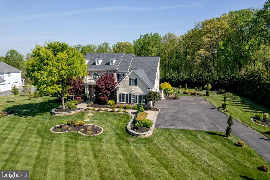 Crafted with top-tier materials and exceptional attention to detail, this stunning 6-bedroom, 6.5-bath home offers luxury living at every turn. Situated on a premium lot with beautiful landscaping, the home features newly installed 9.7 kW owned solar panels, a newer roof, well-maintained systems, and a three-car side-load garage. A grand two-story foyer welcomes you with an elegant curved dual staircase design, setting an immediate tone of sophistication, enhanced by Brazilian mahogany and polished porcelain flooring. A rear staircase provides additional convenient access between levels. The main level features 10-foot ceilings and includes formal living and dining rooms, a private study with double doors, a convenient half bath, and a spacious family room with a gas fireplace that seamlessly flows into the casual dining area and gourmet kitchen. The chef’s kitchen is equipped with Viking appliances, an oversized island, a walk-in pantry, a built-in ice maker, and an additional wall oven. A convenient mudroom with an additional refrigerator completes the main level. Upstairs, the luxurious owner’s suite features a sitting room, spa-inspired bath with dual vanities, and an enormous walk-in closet. All additional bedrooms include en-suite baths and walk-in closets, along with a second-floor laundry room for added convenience. The fully finished lower level expands the living space with two recreation areas, a media room, a bedroom with full bath, a fitness room, a gas fireplace, a wet bar, and ample storage. No detail has been overlooked in this extraordinary home—designed to impress and built for comfort, functionality, and refined living. Make this home part of your story.