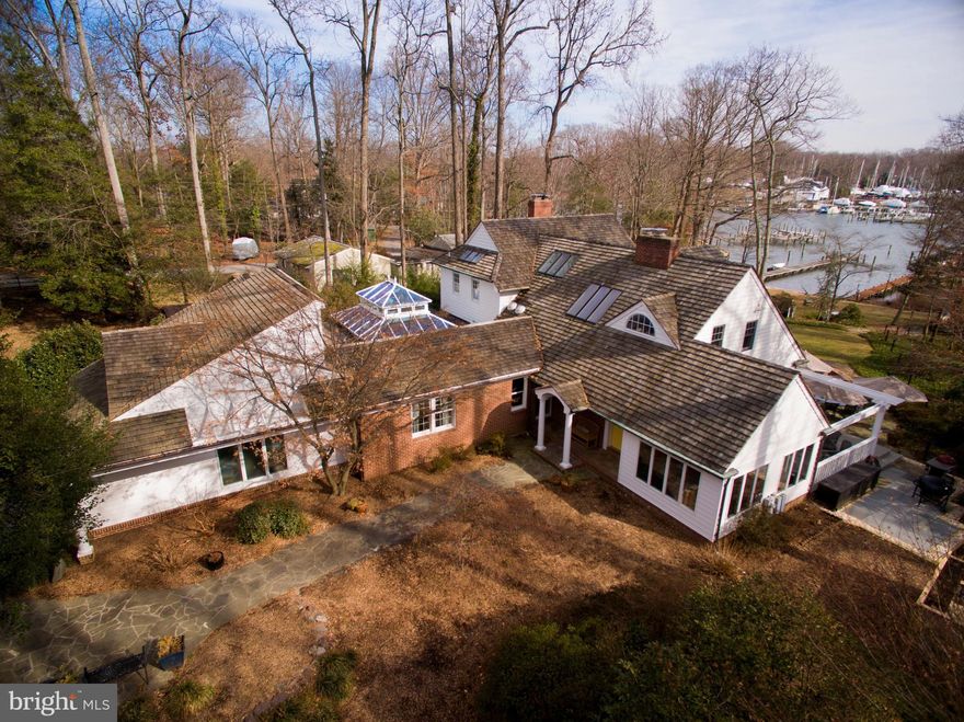 Gorgeous waterfront home on Whitehall Creek. Custom renovation design by Hansen Architects. Master suite w/gas frpl, barrel-vaulted ceiling, lrg marble bath & his/her walk-in closets. Gourmet kitchen w/Viking range & Subzero fridge. Stunning conservatory w/mosaic/marble floors. Add'l features: elevator, custom trim, coffered ceiling & skylights. Potential 1st Flr mstr. Priv deepwater pier w/lift..