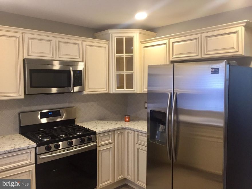 Welcome to this completely renovated Port Richmond home where everything has been meticulously and tastefully designed and fulfilled. This designer kitchen contains the Samsung suite package with continuous grade gas range and two door stainless steel refrigerator.  A brand new half bath has been added for your convenience on the main level. There is also a back yard outdoor spave for your entertaining and possible pets!  The upper level has 3 bedrooms and a beautiful full bath with designer custom tilework. The basement is clean and freshly painted for all your storage needs and is ready for the new owner to finish into your own new space. All this beauty and new energy efficient heater and central air!  Ready to move in, just pack and go!!