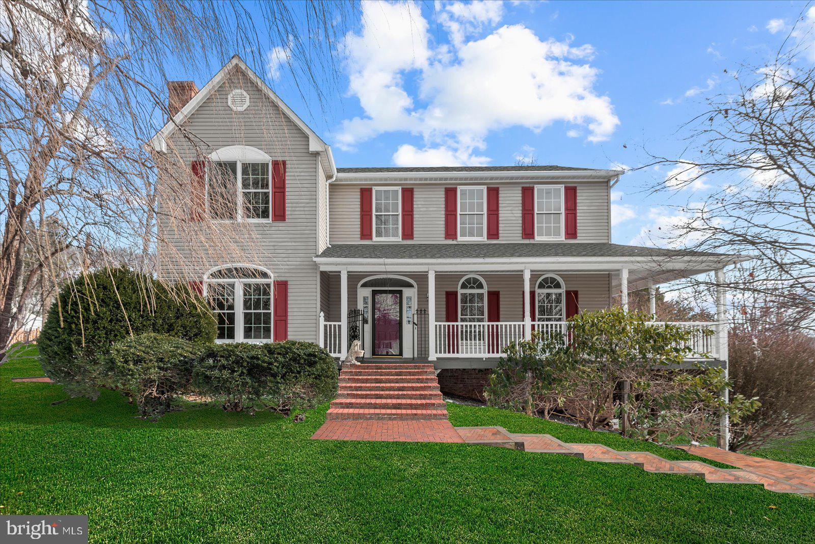 Nestled in the breathtaking Blue Ridge Mountains, this stunning custom-built Colonial in Paris, VA, offers a perfect blend of charm, modern updates, and serene living. Boasting three bedrooms, three and a half baths, and a versatile flex space in the finished basement (not to code as a bedroom), this beautifully renovated home is ready to welcome its next owner. The main floor features brand-new luxury vinyl plank flooring throughout, complementing the elegant kitchen with its beautiful granite countertops. The bathrooms are equally impressive, showcasing timeless quartz surfaces. Abundant natural light floods the home through Palladian windows, enhancing the spacious layout and creating a warm and inviting atmosphere. The finished basement is a cozy retreat, complete with floor-to-ceiling built-ins and a stunning brick fireplace. Situated on just over an acre, the home is framed by a charming wrap-around porch that offers panoramic views of the surrounding mountains, making it the ideal spot to unwind and take in the beauty of nature.
Located in the historic town of Paris, VA, this property provides a rare opportunity to enjoy the tranquility of a picturesque mountain community while being just an hour from Washington, D.C., thirty minutes to Winchester, and an hour and fifteen minutes to Fredericksburg. Paris is home to landmarks such as The Ashby Inn and the renowned 900-acre Ovoka Farm, known for its Wagyu cattle. The town’s historic charm is further highlighted by its antique shops, a tavern, an old schoolhouse, and its quaint churches.
With its perfect blend of historic character, modern updates, and proximity to everything you need, this home is a true gem. Schedule your private tour today to experience the beauty and charm of this one-of-a-kind property!