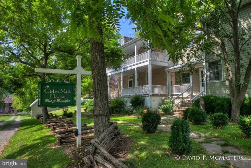 "Cider Mill" Gracious Estate 1810 stone mill  house,expanded, renovated into a wonderful large home.  Set into a hillside w/ babbling brook, bubbling spring, huge, mature trees. Marvelous renovation; comfort and quiet. Nice in ground pool, trails, GREAT PORCHES, very comfy rooms with varied character. Sold w/ 5 acres..  Beautiful setting. On state road 15 min to I-81.Additional  land available.