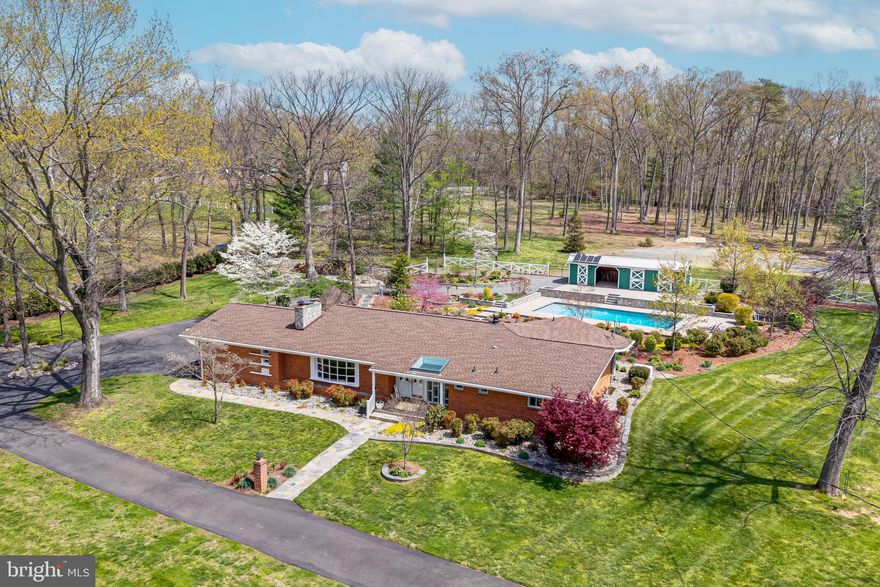 Welcome to your private sanctuary in the prestigious Bull Run Estates. This well maintained 1-story ranch home is perfectly situated on 5.25 sprawling acres of meticulously manicured grounds. Boasting 3 spacious bedrooms and 3 full bathrooms, 2 attached garage, this residence offers an seamless blend of comfort and sophistication.
Step outside to discover a landscaping masterpiece that surrounds a sparkling pristine pool, creating an unparalleled backyard oasis for relaxation or high-end entertaining. A rare gem that combines expansive land with effortless one-level living. Enjoy your own sparkling outdoor pool, the centerpiece of backyard designed for your ultimate relaxation. Gather around the campfire pit for cozy evenings under the stars, grow your own vegitables and much more...