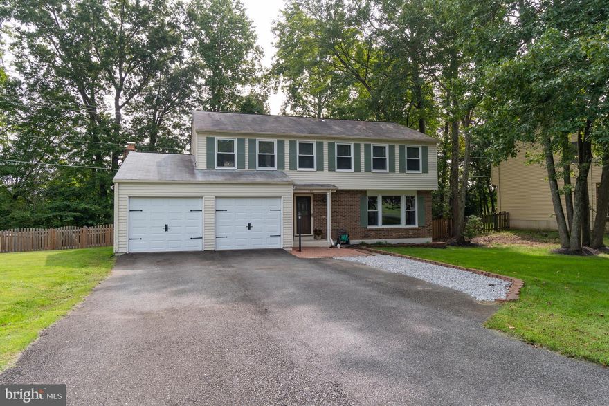 Located in the first section of amenity-rich Aquia Harbour, this lovely home features 4 bedrooms, 2.5 baths, extensive bamboo flooring on the main level, and separate living and dining rooms. The upgraded kitchen boasts Corian counters, hickory cabinets, stainless appliances, and under-mount cabinet lighting. The kitchen is open to the family room with a brick, wood-burning fireplace and slider to the back deck. Wood steps with wrought iron rails lead to the upper level. Upstairs you will find the master suite with a walk-in closet, attached bath, three additional bedrooms, and a full bath. New Fence, 2019. The deck is being sold as-is, but deck boards, steps, railings have been recently replaced, and sellers installed solar LED light caps as well. Plenty of parking with the 2-car garage with added LED lighting, and large driveway. The lower level offers room for expansion. This lovely home sits on a flat .49-acre lot backing to trees and a common area. Enjoy relaxing evenings on the back deck and patio. The fenced yard is great for children and pets. The lot extends past the fence. A storage shed and garden boxes are behind the fence. Close to the Marina, Pool, Dog Park, and Stables. Easy access to I-95, MCB Quantico, FBI Academy, commuter lots, shopping and restaurants.