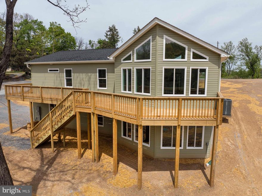 NEW PRICE!   Welcome to your brand-new home, perfectly situated on almost an acre lot just minutes from the amenities of Front Royal! Offering 1,420 finished square feet of thoughtfully designed living space, this home combines modern luxury with everyday comfort.

Step inside to find a bright, open floor plan with vaulted ceilings and luxury vinyl plank flooring throughout the main living areas. The spacious great room flows seamlessly into the upgraded kitchen, featuring granite countertops, stainless steel appliances, and plenty of workspace — perfect for cooking, entertaining, and gathering.

The private primary suite offers a true retreat with a walk-in closet and a stunning, oversized tiled shower. Two additional bedrooms with plush carpeting and a full hall bath provide plenty of space for family, guests, or a home office. Convenient main-level laundry adds to the home's practical layout.

The unfinished basement is flooded with natural light and includes a rough-in for a future full bath — offering endless possibilities for future expansion.

Outside, enjoy peaceful mornings on the full-length front porch or summer evenings on the rear deck overlooking your expansive lot. The attached 2-car side-load garage provides secure parking and additional storage space, adding even more functionality to the home.

Other highlights include:

1-Year DPOR-backed builder warranty

Located in a Sanitary District (fees included with real estate taxes)

Easy commuter access to I-66

Minutes to hiking trails, the Shenandoah River, wineries, and the vibrant downtown Front Royal