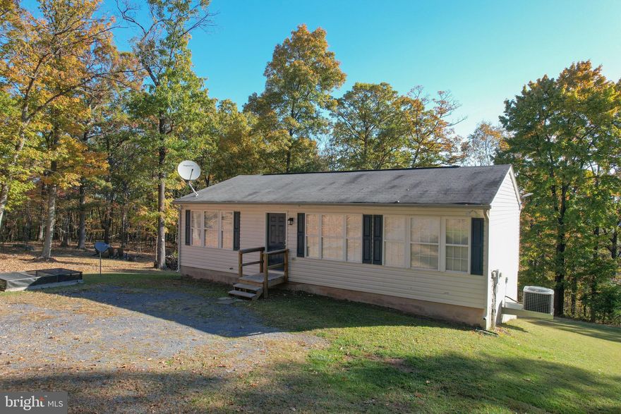 Welcome to 757 Pee Wee Lane! Have you been waiting for your private wooded retreat? Here is the one you've been looking for! With West Virginia living at its finest, you can grow your own food, have a gorgeous view from your brand new back deck made with Trex, and be steps away from Sleepy  Creek Wildlife Management Area spanning almost 23,000 acres for endless hiking, hunting, fishing, camping and nature enjoyment! This CHARMING 3 bedroom, 2 bathroom home is so fresh and move in ready with new paint, flooring, stainless appliances, brand new stove and all others appliances replaced within the past few years!  Soak in the gorgeous view from your kitchen sink, and large windows that span the entire front of the home. The home has a FULL unfinished walk out level basement, with a work bench, partially finished room, roughed in plumbing to add an extra bathroom if you wish, with washer and dryer conveying. Lots of parking space in the front of the home. Work from home? Starlink system is already installed, just start your own service! Enjoy the strawberry raised bed in the front of the home, blackberry bushes in the rear, as well as the elderberry trees, and fire pit area with bistro string lights. Four lots total this almost 5 acres,  keep it all, build on one, sell one, the opportunities are nearly endless!