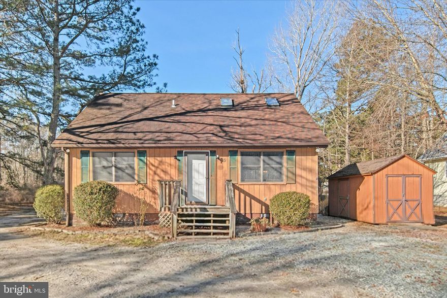 Here’s your chance to own a charming beach cottage in the highly sought-after, waterfront community of Ocean Pines, a place known for its relaxed coastal lifestyle, abundant amenities, and natural beauty. Set across nine miles of Eastern Shore waterfront and more than 3,000 wooded acres, Ocean Pines offers a true sense of community paired with resort-style living. This three-bedroom, two-bath cottage is full of character and ready for your vision. Inside, the main level features two bedrooms, a full bath, a generous kitchen and dining area, and a living room with a vaulted ceiling that creates an open, airy feel, an ideal foundation for reimagining the space. Upstairs, you’ll find an additional bedroom, a second full bath, along with a finished bonus area that offers flexibility for a home office or guest retreat. Practical touches include main-level laundry, a large lot with an open backyard, and a storage shed, perfect for beach gear, bikes, and tools for future projects. With its solid layout and classic cottage charm, this home presents a wonderful opportunity to update and customize while building equity in a beloved coastal community.
Ocean Pines residents enjoy access to a beachfront restaurant in Ocean City, a public yacht club, five pools, two marinas, a premier racquet sports complex, and a golf course, all just minutes from shopping, dining, and the Ocean City beaches. Whether you’re searching for a weekend getaway, a full-time residence, or a renovation project with upside, this Ocean Pines cottage is brimming with potential and perfectly positioned to enjoy everything the area has to offer.