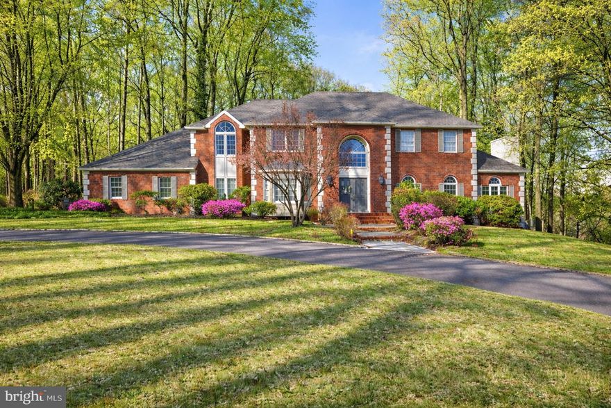 165 Arreton — A Wise Choice for a Refined Life！
Set within the wooded surroundings of Princeton Ridge, this brick-front home backs to mature trees and offers a sense of privacy while remaining just minutes from downtown Princeton, schools, dining, and cultural amenities. With five bedrooms and a three-car garage, the home is designed for both everyday living and entertaining.

The first floor features a two-story foyer with inlaid marble floors. Two entry closets provide convenient storage. Formal spaces, a living area with a fireplace and French doors to the deck, and a kitchen with a breakfast room are thoughtfully connected. A first-floor bedroom with a nearby full bathroom adds flexibility.

The second level includes four bedrooms. The primary suite offers a sitting area, a skylit bathroom with a soaking tub and separate shower, and a walk-in closet. Upstairs windows overlook the yard and surrounding greenery.

The finished walkout basement provides additional living space, featuring a home theater, bar area, sauna, and a full bathroom. With direct outdoor access, this level offers a natural connection to the wooded setting and is well suited for relaxation and gatherings.

165 Arreton, a quietly blessed place to call home, awaits you!!When you’re ready, contact us to begin your next chapter.

One of the owners is a licensed real estate agent.