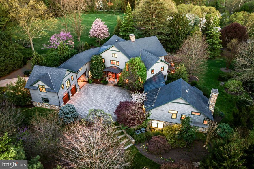 Welcome to this one-of-a kind, artistically conceived "Architectural Digest" post and beam residence, meticulously designed by Mathew Millan and custom constructed by master builder Frank Zadlow with artisan refinements by renowned ironworker Greg Levitt. Set on a private, beautifully landscaped 3-acre lot in the coveted "walk to Wayne" location of Radnor Township, it features soaring ceiling heights with expansive sun-filled windows, a fabulous open floor plan leading out to the beautiful grounds and gardens, historically incorporated details including the inclusion of massive beams that were once part of The Academy of Music's roof structure, a 2-story stone fireplace at the back of the entrance foyer and front of the great room, fabulous Italian inspired custom gourmet kitchen with soapstone, limestone and oak countertop that was hand crafted from an additional Academy beam, gourmet appliances, caterers' kitchen, cozy first floor library/ music room with built-in sound system, luxurious first floor primary suite featuring a Japanese aesthetic throughout, dramatic loft looking over the entire first floor, 2 additional second floor bedroom suites, 2 open air offices overlooking the awe-inspiring beams and depth of the 2-story central living spaces, bonus room which could also be converted to an incredible bedroom suite, lower level ionized pool with full bathroom, wine cellar with welcoming tasting room and lots of additional storage, recreational space. Seize the rare opportunity to purchase a sophisticated, timeless yet jaw dropping property that lends itself perfectly to comfortable living and effortless entertaining on a small or large scale. Close to renowned public and private schools, countless clubs and recreational facilities, equestrian facilities, hiking trails, restaurants, shopping, all forms of transportation and more.