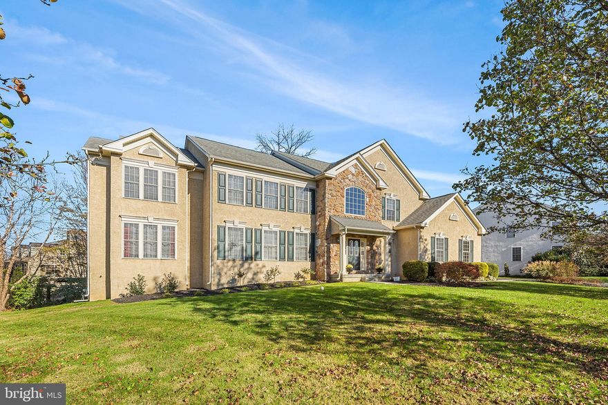 The richly beautiful Black Walnut Tree is highly regarded for strength and rarity- 106 Black Walnut  Lane certainly fulfills this namesake. Filled with upgrades, this custom built home is exquisitely updated and maintained. This stone colonial is a rare opportunity in the coveted Spring Mill Estates in award-winning, Colonial School District. As you approach 106 Black Walnut you are greeted by a meticulously landscaped front yard, large driveway and a 2.5 car side entry garage. Step inside and notice the gorgeous foyer with hardwood flowing throughout the first floor.  To the left of the foyer is the formal sitting room with ample natural light and separate formal dining area. Behind the dining room is the first floor office suite with views of the backyard. Enter through the back of the kitchen through the separate butler's pantry/coffee bar, to find a beautifully updated kitchen complete with soft close white custom cabinetry, neutral stone countertops and stainless steel appliances. Some kitchen highlights include seating all around the island to allow for more guest entertaining while still having ample room for a large dining table, reading nook with hidden storage, and walk-in pantry.  From the kitchen table you can enjoy views of the yard through the french doors or venture out to composite deck to enjoy your morning coffee in the morning sunshine. Step down from the eat-in kitchen to the family room complete with fireplace and access to the second back stairwell. The first floor is completed with a half bath off of the foyer, coat closet, and garage access. On the second floor you will be delighted by the open hallways to the floors below. The expansive owner's suite has 2 walk in closets and ensuite bathroom. This updated bath includes gorgeous neutral tiles, freestanding Ariel whirlpool tub with digital temperature, colored light and bluetooth controls. The bathroom also features a dual sinks with vanity seat, tiled glass shower, and water closet. Just in case a little extra space is required- the owner's suite includes a bonus room which can be used as nursery, changing room, office space, home gym or countless other options! Down the hall from owner's suite is 3 additional sizable bedrooms each with ample closet space. At the end of the hall is the laundry room conveniently located on the upper level of the home with extra closet space.
The fully finished basement boasts another approximately 1,800 sqft with tons of hidden storage spaces, a large bar area, fireplace, game area for billiards or foosball, sitting area and a full bathroom. The space was originally framed as an in-law suite complete with kitchen area and bedroom space complete with closet before being converted to a flexible family and entertaining space. The basement also contains a walk out sliding door which leads out to a  beautiful paver patio with quiet views of the tree lined yard.  Close to all major highways and access to plenty of shopping and restaurants. Make your appointment today!