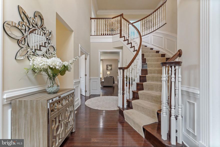 Close to Longwood Gardens, West Chester, Kennett Square and Wilmington, and in the AWARD WINNING school district of Unionville, with wonderful dining and shopping options nearby, this stunning, well appointed home sits in the heart of the neighborhood, backing up to open space with magnificent views.  Front the moment you walk up to the front door; you will fall in love with the charming covered patio and entry. Once inside, you will appreciate all of the upgrades and lovely finishing touches, extensive molding, hardwood floors throughout, and truly special finishes. The front entry foyer is flanked by the formal living and dining rooms, with a main level office and half bath just beyond which could easily be converted into a main floor bedroom and there is enough room in that area to convert the half bath into a full bathroom. The rear of the home is an OPEN CONCEPT kitchen, family and sun room area. The kitchen is truly a chef’s delight with an expansive center island with counter seating, stainless steel appliances, stunning granite, and a separate large kitchen table area. The adjacent family room is light filled, includes a gas fireplace and boasts some of the best views in the neighborhood. The sun room just beyond the kitchen is a lovely place to enjoy a pre-dinner cocktail or simply relax with a cup of coffee. Just outside the sun room is a gorgeous paver patio that affords spectacular views of the community open space that exists behind the home and the wooded land just beyond. On the upper level, the master suite has a beautiful custom tiled shower, a large soaking tub, separate toilet area and dual vanities. There are three additional bedrooms on the upper level, each with its own en suite bathroom. At the end of the hall is a second-floor family room which the sellers are using as a HOME THEATER ROOM, the perfect place to let the younger generation play video games and entertain their friends or curl up and watch a favorite movie. There is a huge, partially finished, basement with extra high ceilings, a full daylight walk out double glass patio door exit, and one fully finished bedroom space complete with hardwood floors and a large walk in closet or use that as a second home office or even professional office space since there is a separate walk out entrance.   The outstanding school district, the central location within the neighborhood, the magnificent VIEWS from almost every room in the house  of the adjacent open space and woods beyond make this one of the best choices. Come see this lovely house for yourself and you will want to call it home.