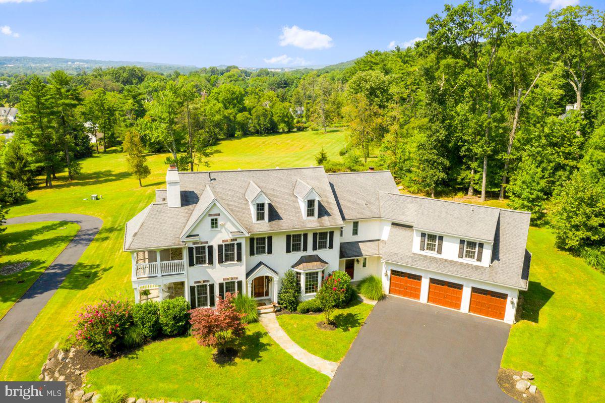 This wonderful house built by premier builder Kurt Wolter and designed by respected architects McIntyre & Capron is situated on a private road on 2.33 Pastural acres. You enter the house to an elegant front to back center hall with doors leading to a slate patio. The living room has an in & out fireplace that has 2 sets of French doors that lead to a covered porch. There is an elegant dining room and an office with custom built-ins. The large kitchen with custom wood cabinetry and granite counters, has top of the line appliances and a large island that opens to a breakfast area that has glass paned doors leading to the slate patio. There is a huge family room with vaulted ceiling, fireplace, custom built-ins, dry bar and, massive Palladian widow making this whole area extremely bright with tremendous views. Completing the first floor are 2 powder rooms and large mudroom, with its own outside entrance, that also leads to the 3-car garage. Upstairs is the primary suite with sitting room, bedroom with tray ceiling and double French doors that lead to a covered porch, 2 walk in closets and a spa bath with double vanities, soaking tub, and large glassed-in shower. Completing the 2nd floor are 4 more spacious bedrooms and 3 baths, a separate laundry room, and a rear staircase. There is a walk-up unfinished attic for extra storage. The daylight lower level is unfinished but has high ceilings and sliders to the outside and can easily be converted to a rec room. This house has beautiful architectural detail throughout and 10-foot ceilings making it the perfect house for entertaining and offering a superb quality of lifestyle. In the award winning Tredyffrin-Easttown school district, It offers privacy yet is close to Wayne and Devon shopping and amenities , the King of Prussia Mall, Pa turnpike, commuting trains, Rt 202, and Valley Forge Park.