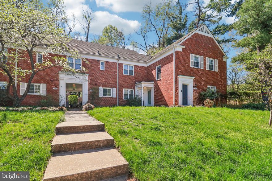 This well-kept first-floor condo is located within the historic ParkFairfax community, originally built between 1941 and 1943 to offer convenient housing near the Pentagon. Set across 132 acres of mature trees and open green space, the neighborhood provides a quiet, park-like environment just minutes from the Pentagon, Shirlington, Old Town, and Washington, DC. Residents enjoy access to 1,684 units along with a wide range of amenities, including three swimming pools, eight tennis courts, two volleyball courts, a fitness center, scenic walking paths, and nearby bus service.
Inside, the condo features a spacious, open-concept living area with flexibility for dining, entertaining, or working from home. Large windows and a glass door bring in abundant natural light and lead out to a private brick patio surrounded by trees, offering both privacy and a peaceful outdoor retreat. The dining space is accented with custom built-ins, a granite ledge beneath the windows, and updated lighting that adds warmth and character. The kitchen was renovated in 2014 with shaker-style cabinetry, soft-close drawers, neutral tile flooring, upgraded countertops, and modern lighting. The bathroom was also refreshed between 2014 and 2015 with updated finishes.
Additional improvements include a refrigerator, gas stove, and microwave installed in 2014 (with the microwave updated in 2023), a dining room A/C unit added in 2023, a bedroom A/C and heating unit from 2019, a reglazed bathroom in 2023, and an electric washer and dryer installed in 2024. The living room’s electric baseboard heating was replaced in 2025. Storage is plentiful with a coat closet and access to a community storage area located in the same building as the shared laundry facility. The original parquet floors have been refinished, highlighting their classic appeal and adding timeless charm throughout the home.
The condo fee includes gas, water, trash, and snow removal, simplifying day-to-day living. With close proximity to shopping, dining, and public transit, this home offers a seamless combination of comfort, convenience, and location. Don’t miss the opportunity to make this inviting Parkfairfax residence your own.