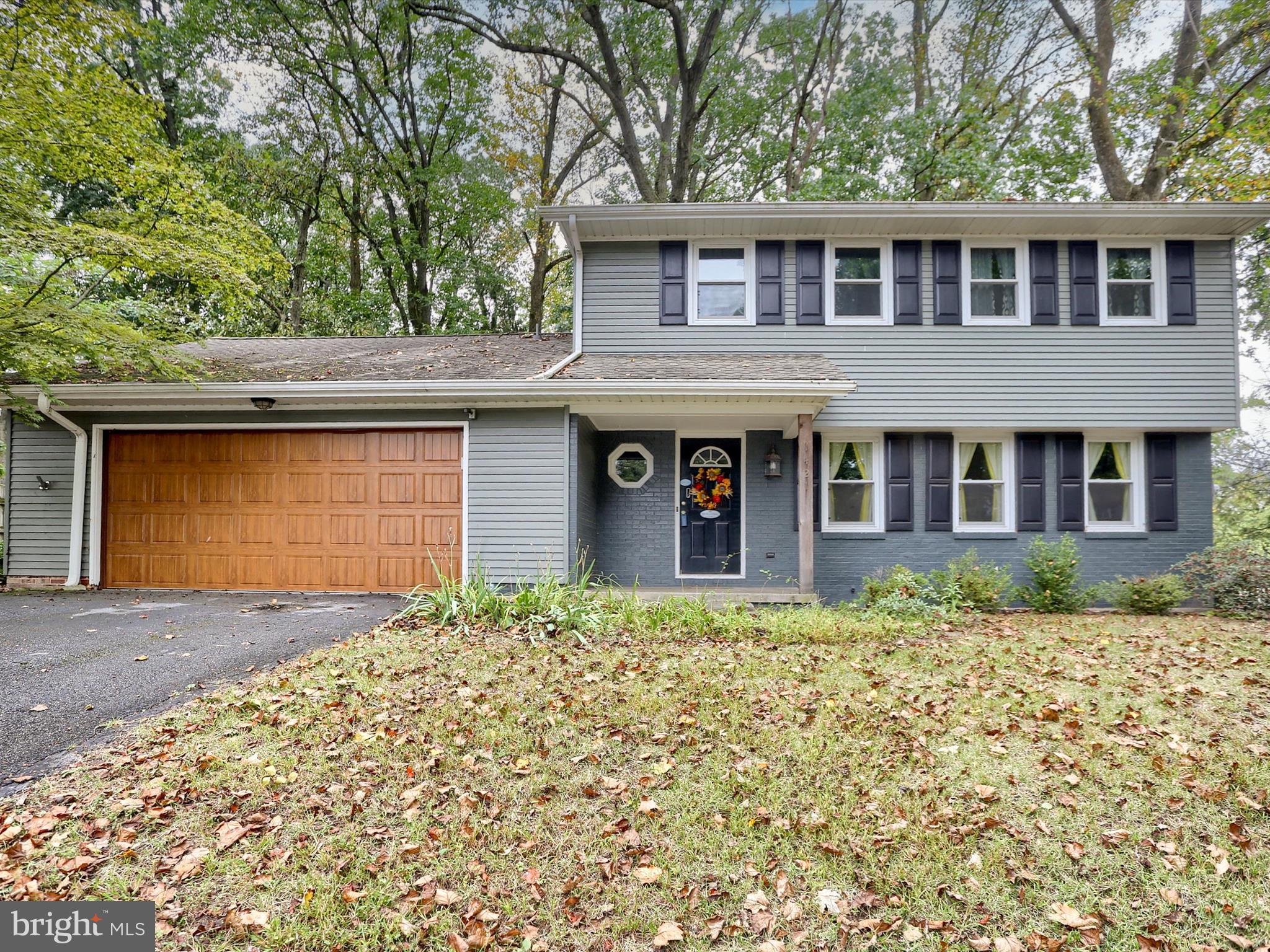 Just minutes from Hershey Medical Center, this modern home combines classic comfort with contemporary flair. Step inside to warm hardwood floors flowing throughout, leading you to a family room anchored by a cozy wood-burning fireplace—perfect for quiet nights or lively gatherings.
From the covered side porch with its own fireplace, you can entertain year-round, surrounded by the beauty of nature. Upstairs, the primary suite opens to a private balcony that feels like a treehouse, where you can sip morning coffee, listen to the breeze through the trees, and take in the view.
Nestled on a fenced, wooded lot in a small neighborhood at the top of the hill, this home offers both privacy and a sense of community.