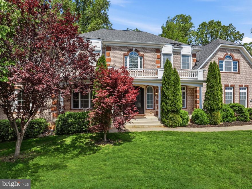 A rare opportunity to own a custom-built luxury estate in Clifton, VA, designed for privacy, multigenerational living, and long-term self-sufficiency in one of Northern Virginia’s most sought-after settings.
Set behind a circular driveway, this 6-bedroom, 5.5-bath residence immediately stands apart with imported Italian bronze front doors and a dramatic two-story foyer. The main level features 10’ ceilings and a full bedroom with walk-in closet and private bath, ideal for guests, extended family, or a main-level primary suite option.
At the center of the home, the gourmet kitchen is built for both everyday living and entertaining, offering newly updated white cabinetry, black granite countertops, an induction cooktop, farmhouse sink, wine fridge, and a walk-around pantry. It flows seamlessly into the expansive family room with coffered ceilings, a wood-burning fireplace with stone surround, and architectural columns. A formal dining room and separate living room provide additional space for gatherings, while a secondary staircase adds convenience and function.
Upstairs, 9’ ceilings lead to a light-filled primary suite with tray ceiling and oversized windows. The spa-inspired bath includes a soaking tub, dual granite vanities, an oversized walk-in shower with dual shower heads, and a custom wraparound closet with its own dedicated laundry area. Three additional bedrooms include a private en suite, plus a well-appointed hall bath.
The fully finished lower level offers a true multigenerational or nanny suite, complete with a second kitchen, living area, bedroom, and full bath. Two large additional spaces, currently used as a gym and art studio, provide flexibility for storage, hobbies, or future customization.
What truly differentiates this Clifton estate is its infrastructure and long-term efficiency. Features include a 320’ well, dual-zone drain field, a 1,000+ gallon buried propane tank, generator hookup, whole-house water filtration, commercial-grade water heater, Tesla charger, and 2x6 framing for enhanced insulation and structural integrity. These elements offer a level of independence and durability rarely found in comparable homes.
Outdoor living is equally impressive, with a Trex-style deck, screened-in porch, fire pit and seating area, multiple storage buildings, invisible pet fence, and a three-car garage with smart opener and utility sink. Even the entry chandelier is mounted on a hoist for ease of maintenance, reflecting the thoughtful design carried throughout.
Located just minutes from the charm of Clifton’s boutique shops and dining, and close to Hemlock Regional Park and Bull Run Marina, this home offers a unique balance of privacy and accessibility with convenient access to major commuter routes.
For buyers seeking a luxury home in Clifton, VA that goes beyond aesthetics, this property delivers space, flexibility, and infrastructure designed to support the way you live today, and for years to come.