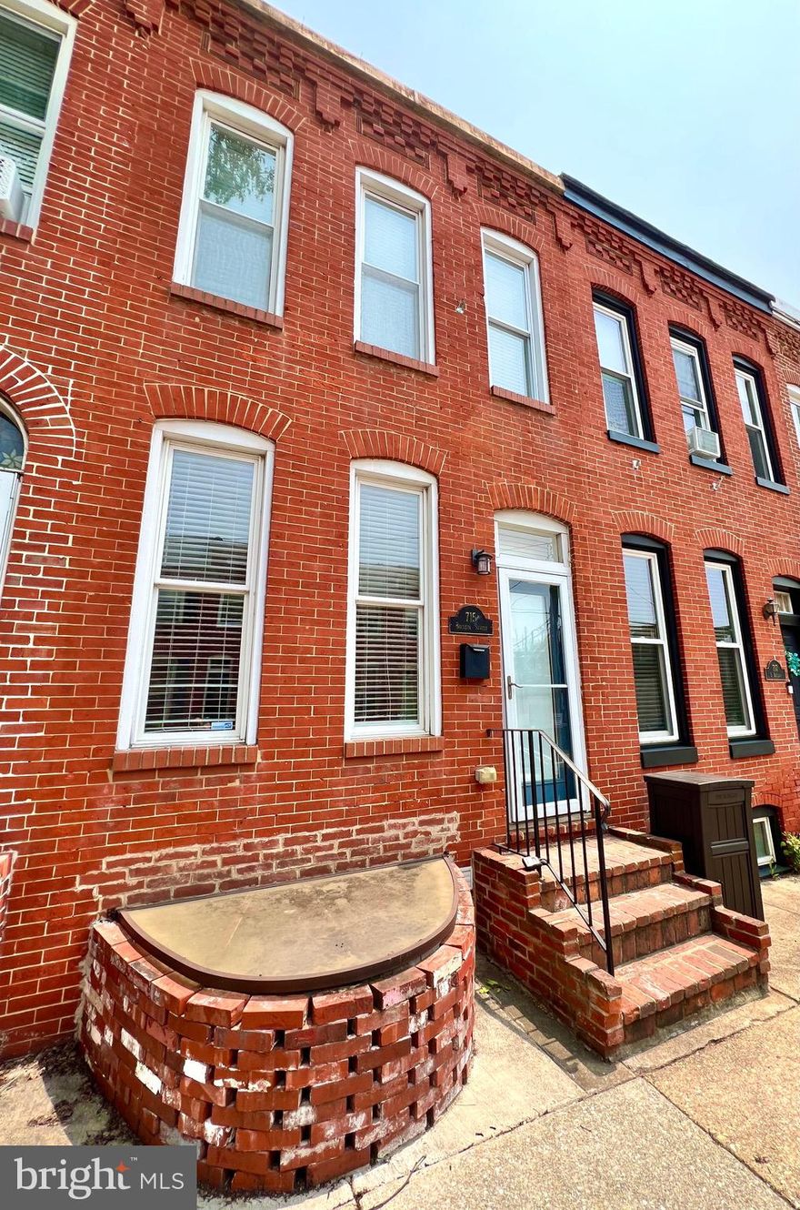 Live in the heart of Canton’s sought-after waterfront neighborhood!
This stunning 3-bedroom, 3.5-bath rowhome combines classic charm with modern upgrades and an unbeatable location. Highlights include a large  parking pad and a rooftop deck with panoramic city views—perfect for relaxing or entertaining.

Inside, you’ll love the gorgeous hardwood floors throughout, exposed brick, and recessed lighting on the main level. The stylish kitchen features granite countertops, gray cabinetry, and stainless steel appliances—a perfect space for cooking and gathering. A main-level half bath and washer/dryer add everyday convenience.

Upstairs, the front bedroom features an en suite bathroom, while the rear bedroom is served by a full hall bath. The third bedroom is located in the finished basement and includes its own  full bathroom—a great option for guests, a home office, or a quiet retreat. The home also includes dual-zone heating and cooling for year-round comfort.
All of this in a prime Canton location—just steps from the waterfront, parks, restaurants, and everything city living has to offer. Don’t miss it!   Live smart. Live stylish. Live Canton.