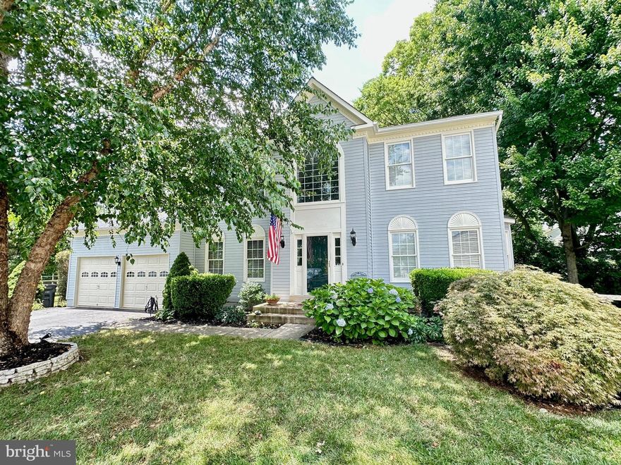 This is what you've been waiting for! Stunning colonial home perfectly situated in a serene cul-de-sac adorned w/ mature trees and landscaped gardens, offering both privacy and a large flat 1/3 of an acre lot.  The home boasts over 2,800 square feet of finished living space across the top two floors, this elegant three-level home promises spaciousness and delight at every turn.  As you enter the main level through the front door you are welcomed by a grand two story foyer that is graced with a magnificent Palladian window bathing the area in natural light.  In the foyer you'll see a door to your left,  through it is a private study tucked away from the rest of the home ensuring peace and quiet.  The study/office has views of the front yard and garden beds providing a serene workspace. To the right of the entry foyer you enter into the formal living room with a bay window bump out, which is connected to the formal dining room with an additional bay window bump out. The entire main level features soaring nine foot ceilings and a blend of real and engineered hardwood floors. Straight ahead through the foyer and under the staircase you enter the kitchen with classic and timeless white cabinetry, a brand new quartz countertop and enormous single basin stainless steel sink with well thought out features, and a large island for entertaining a crowd!  Just passed the kitchen cabinetry is a huge space for a large kitchen table with a bump out that has a door flanked by floor to ceiling windows on either side letting in natural light and providing an exit to the rear yard. The spacious kitchen is ideal for hosting gatherings and creating culinary adventures. The kitchen & family room are open concept and flow together making it a great entertaining space. The luminous & vast family room  is highlighted by a vaulted ceiling, skylights, a fan/light, and a welcoming fireplace that serves as the focal point. Off the kitchen is a Laundry/Mud Room, conveniently located on the main level with direct access to the expansive two-car garage that has been recently painted and the floor has been treated and sealed.  On the upper level, you will find a lavish primary suite with vaulted ceilings a fan/light, a large expansive walk in closet, a luxurious bath with vaulted ceilings, dual sink vanities, a large mirror, large soaking tub and separate large walk in shower.  The upper level which has engineered hardwood floors throughout and ceramic tile in the bathrooms has three generously sized secondary bedrooms, two that are adorned with two large skylights and all with ample closet space. The hallway bathroom is elegantly updated and hosts a shower/tub combo. The lower level is a versatile area that is currently unfinished and housing the utilities in one corner and provides tons of space for the new owner to use as storage or finish off for additional living space. The exterior of the home is in fantastic condition with a well manicured lawn, painted and maintained wood trim, and beautiful vinyl siding.  The backyard is fenced in and has a nice raised garden bed, a brick paver patio for outdoor grilling and chilling  and is abundant with trees and shrubs for the ultimate privacy.  This home has been carefully maintained by the original owner with these recent updates; 2024 interior painting to include walls, ceilings, doors, wood trim, and garage.  The garage floor was refinished in 2024, Garage doors were replaced in 2023, HVAC in lower level, that services the basement & main level, was replaced in 2021. New architectural shingle roof replaced as well as ALL of the skylights  2021!   2021 also brought attic insulation replacement for efficiency,  2017 upper HVAC replaced and 2016 new hot water heater installed.  Home is conveniently close to shopping, dining, train station, and commuter routes 66 & 28, and about 30 mins to Dulles Airport.  Wellington Community has great amenities! Don't miss this gem! Professional photos coming soon!