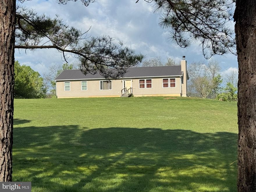 Mountain Views + Prime Location = Opportunity!
If you’ve been looking for a place with potential in a great spot, this one is worth a look. Situated on 2.5 acres just minutes from downtown Berkeley Springs, you’ll enjoy beautiful views and easy access to all the shops, restaurants, and charm the area is known for.
The home appears to be in solid condition and already has a new roof (2020)—a big bonus. Inside, it’s ready for your vision. The carpet needs to be removed, but with fresh paint, new flooring, updated appliances, and a little landscaping, this property could truly shine again.  The floor plan is open with a nice flow that could be utilized in different ways, lots of natural light, screened porch and deck off the back to enjoy cocktails or group activities, full basement with walkup stairs to the back yard, and the land lays flat to slightly sloping-great for gardens or play!
Light restrictions help protect your investment: no trailers or doublewides, no farm animals (cows, pigs, chickens), and no unlicensed vehicles or junk cars.
Details are limited, and the property is being sold as-is. Inspections are for buyer information only, so bring your ideas and make it your own.
A true diamond in the rough in a location that’s hard to beat—don’t miss the chance to transform this into something special!