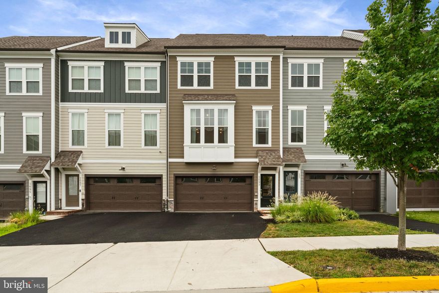 SUPER OPPORTUNITY....Nearly new, beautiful three-bedroom, two-car, sought-after front-load garage townhome located in the prestigious Potomac Shores Community! This home, built in 2022, features a bright, updated, open-concept floor plan. Showcasing a spacious gourmet kitchen with a massive sit-down island, including upgraded white cabinets, white quartz countertops, stainless steel appliances, and LVP flooring throughout the main level! Unwind in the large family room and/or separate dining area right off the kitchen, creating a perfect setting for relaxation and togetherness. Step outside onto the deck to enjoy the fresh air and outdoor entertainment. Retreat upstairs to the second level to your primary suite with a beautiful upgraded private en suite bath and an AMAZING spacious walk-in closet that will not disappoint; this room may become your favorite and will undoubtedly inspire you to put your feet up and relax. Down the hall, two more good-sized bedrooms with a guest bathroom. The laundry room is also located on the second level for an added level of convenience. Downstairs, the lower level is all LVP flooring and an ample open space with access to the backyard, often used as a flex room which could be transformed into a private home office or even another ensuite off a bedroom with a full bath should you choose to do so, or as a fantastic den area for watching your favorite teams and routing them on ( bookcases to convey)! It is whatever and however you want it. Residents enjoy various community amenities covered by HOA fees, including Verizon high-speed FIOS internet, trash removal, multiple pools, a clubhouse, fitness center, hiking/biking trails, multi-purpose sports courts, and the Jack Nicklaus Signature golf course. This home offers unparalleled convenience and lifestyle options, conveniently located near I-95, US-1, Quantico, and a forthcoming VRE station less than half a mile away. Experience the ultimate in Potomac Shores living—schedule your tour today and discover this home's limitless possibilities!