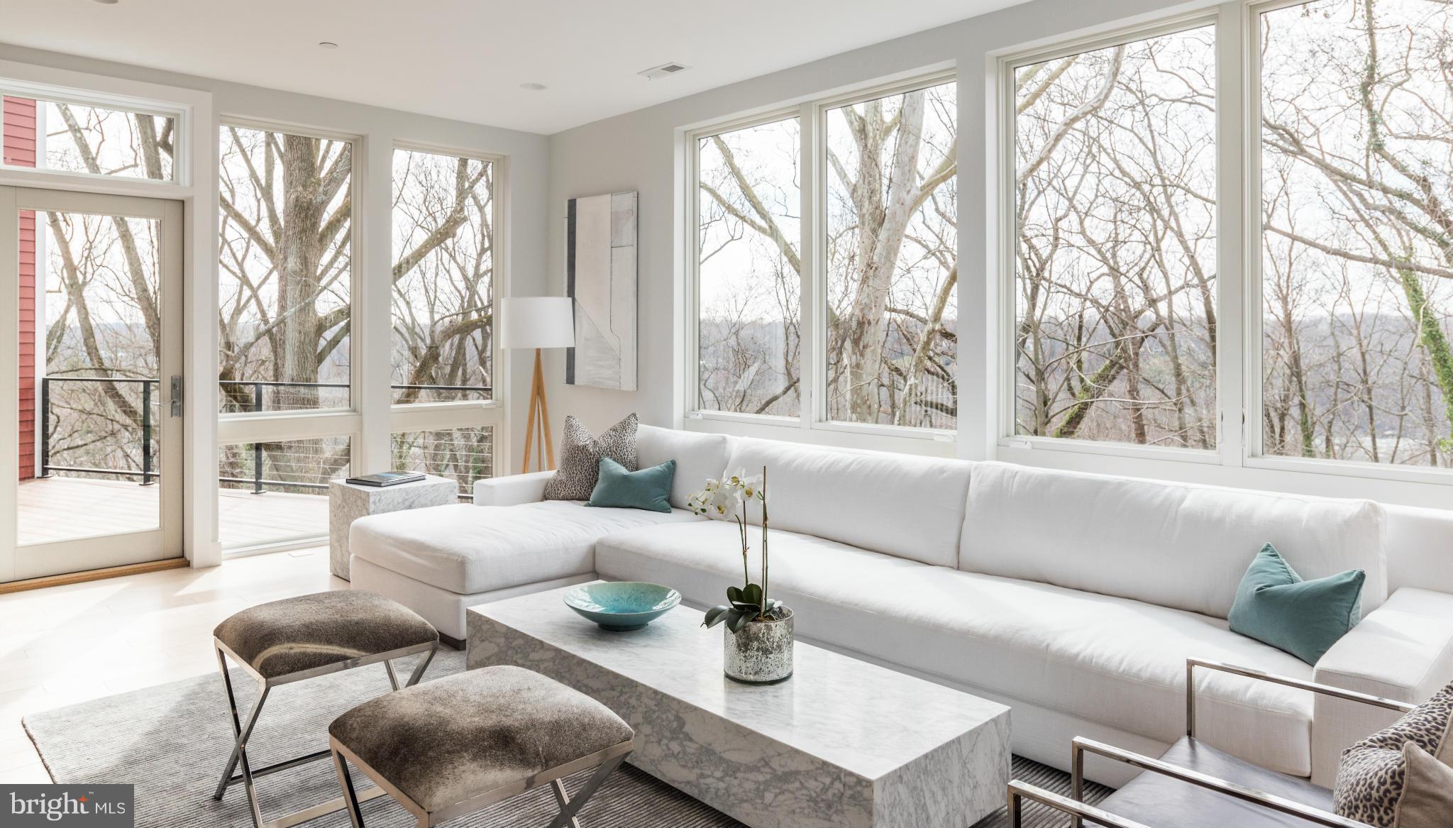 Open Sunday, 8/20, 1-4. Brookes Ridge features 11 beautiful new town homes in Bethesda. Model home is complete and Phase 1 of sales has commenced. Homes include two car garage, floor-to-ceiling windows, Potomac River views, private elevator, and roof deck. Brookes Ridge is a unique community of homes in a private setting and very accessible to downtown DC. Photos from model unit.
