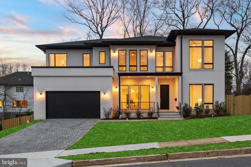 This stunning newly built home, designed by James McDonald, seamlessly blends modern sophistication with timeless craftsmanship. Located in the prestigious Golf Club Manor neighborhood of North Arlington, this residence offers unparalleled luxury, thoughtful design, and an open floor plan that maximizes natural light and seamless indoor-outdoor living.

When you step inside, you’re welcomed by 10-foot ceilings and 9-foot doors on the main level, creating an airy, expansive ambiance. Custom-finished 4-inch oak hardwood floors run throughout, adding warmth and elegance to the space.

The gourmet kitchen is a chef’s dream, featuring all-wood maple cabinetry, quartz countertops, and premium GE Café appliances, including a 42-inch-wide refrigerator and 36-inch-wide gas range. A large butler’s pantry, complete with a wine cooler and rack, provides additional storage and convenience for entertaining.

Adjacent to the kitchen, a beautiful breakfast area offers the perfect spot for casual dining. This space is uniquely designed with three walls of floor-to-ceiling windows, filling the area with natural light and offering views of the backyard. Open to both the kitchen and family room, this bright nook flows seamlessly with the rest of the open-concept layout.

The spacious family room, located just beyond the kitchen, features a double-sided gas fireplace that opens into a sunroom—a flexible space for year-round enjoyment, with two walls that fully open to connect indoors and out.

From the family room, step outside onto the Trex deck, perfect for relaxing or entertaining. The backyard also includes a dedicated herb garden area and a six-foot fence for privacy.

Conveniently located on the main level is the In-Law/Au Pair suite, offering flexibility and privacy with its own private en-suite bathroom.

Upstairs, four generously sized bedrooms each feature en-suite bathrooms and custom-designed closet spaces. The primary suite is a true retreat, with a spa-like en-suite bath, built-in walk-in closets, and a serene sitting area.

The walk-out lower level is filled with natural light and offers versatile spaces to suit various needs. It includes a finished room with a full bathroom and another finished room that can serve as a movie room or gym. Additionally, a large unfinished space offers room to create a custom area to fit your vision.

Additional highlights include a two-car garage that is EV charger ready.

Situated on approximately a quarter acre, this home is ideally located with easy access to Washington, D.C., Tysons, Reagan National Airport, and major commuter routes. The property is part of the highly regarded Jamestown-Williamsburg-Yorktown school pyramid and is near the Washington & Old Dominion Trail, Custis Trail, and several parks, providing fantastic options for outdoor activities like biking, running, and walking.

This is a rare opportunity to own a truly exceptional luxury home in one of Northern Virginia’s most sought-after neighborhoods. Schedule your private tour today and experience the best of Arlington living.