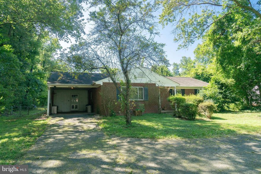 AS-IS handyman special with so many possibilities on over a 1/2 acre flat lot  with carport - Investors special - AS-IS addendum must be part of contract - Hardwood floors throughout that are waiting on your  TLC- Close to Fort Belvoir and  major roads