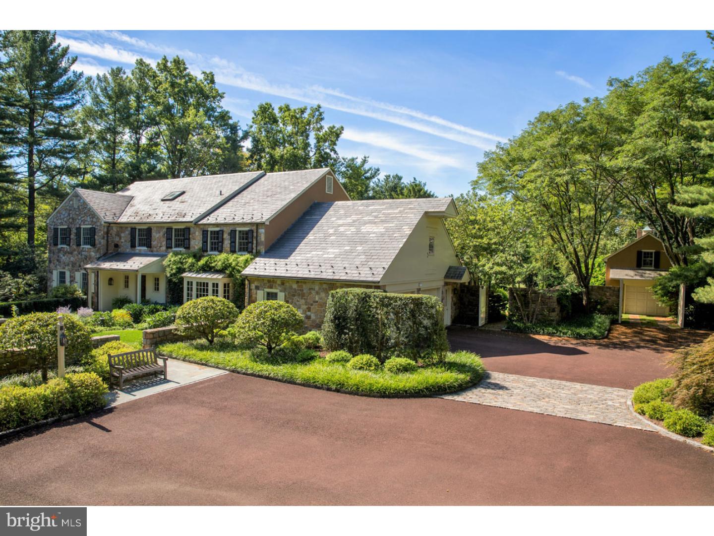 This stunning 5 bedroom, 5.5 bath Colonial home offers historic character coupled with loads of amenities, upgrades and high-quality craftsmanship. Upon entering this charming home, one is immediately struck by the deep windowsills, crown molding, raised panel wainscoting, solid mahogany doors with custom antique brass hardware and custom cabinetry that can be found throughout. The foyer with imported French tile leads to the spacious living room, family room with custom wet bar, and dining room with floor to ceiling windows. The updated gourmet kitchen boasts a large granite center island, custom cabinetry, second prep sink and all new appliances. The adjoining breakfast room has a fireplace and French doors leading to the rear flagstone terrace overlooking fabulous, mature landscaping, grounds and in-ground saltwater pool. A full hall bath and laundry room with 2nd fridge, wine cooler, dishwasher and additional storage complete the first floor. Upstairs, the fantastic master bedroom suite with vaulted ceiling, his + hers walk-in closets, gas fireplace and French doors leading to a balcony with views of the grounds. Three graciously sized bedrooms with updated hall bath and a large princess suite with walk-in closet can be found on the second floor. The third floor offers additional storage options. This oversized lot also includes an attached, 2-car garage, and separate carriage house with 1-car garage, built-in Wolf grill and second floor just waiting to be turned into an apartment or studio. The finishing touches to this exceptional home are the impeccable grounds, terraces, established perennial gardens and custom outdoor lighting.
