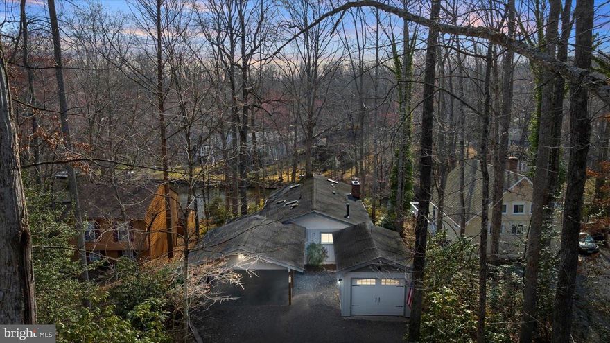 Welcome to your waterfront home in Lake of the Woods! Go fishing right from your dock on Keaton’s Lake. This home has a massive primary suite, with a huge closet, and is great if you're working from home. The primary bathroom includes a spacious tiled shower with dual shower heads. In the living room you will find a beautiful stone gas fireplace. A sunroom adjoins the living room where you can enjoy sipping your morning coffee overlooking the lake. Downstairs you will find 2 bedrooms, one of which has a wood fireplace and another sunroom! Natural light abounds in this house. The third bedroom is large, with a screened in porch right outside the sliding doors. There is also a large flex space that can be used as a bedroom, sitting area, or would be a great workout room. In the Spring and Summer the colors come alive with the plentiful plants and trees. There is a covered carport and detached garage for your convenience, as well as a whole house generator. The backyard has stone pathways, and a bench and fire pit to enjoy your lake view. To top it all off, there is a small pond that could be used as a koi pond. Neighborhood amenities include a clubhouse with restaurant, which serves a fantastic Sunday brunch, a workout center, 2 pools, a beautiful golf course, and so much more. Come make this beautiful lake house your new home.