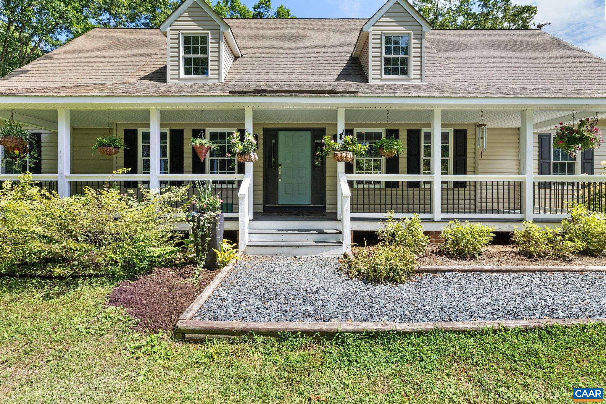 Charming Farm with Pond and Stables nestled between Charlottesville and Richmond and conveniently accessible to I-64. Privately set on 40+acres this property offers a spacious Cape Cod style home surrounded by a blend of pastoral beauty, mature trees and modern comfort. 4 beds and 3.5 baths, +opt. 5 bedroom, 6 stall barn with/tack room, fenced pastures, equipment shed, vegetable garden, large spring fed pond featuring an island, groomed walking trails and a 40 X 30 workshop/training building!! At the home you will be welcomed by a large country porch and once inside greeted by an updated gourmet kitchen, custom cabinetry with premium finishes, lots of granite counter space with tiled backsplash, under cabinetry lighting and stainless appliances.The Great Room features a soaring ceiling and abundant natural light with a wood burning stove framed in stone combined with an expansive deck just steps away, creating a comfortable gathering place.The 1st level Primary Suite includes a walk-in closet, tiled shower and garden soaking tub. An office and laundry/mud room complete the first level. Whether you are a seasoned equestrian or someone seeking a quiet country retreat with high end touches this property is a rare find in Central VA,Granite Counter,Painted Cabinets,Wood Cabinets
