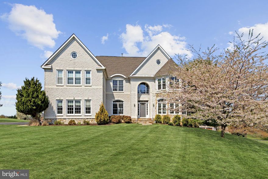 Introducing a property unlike any other in Great Falls! With a spectacular view, modern open floor plan and over $100k in recent updates this is truly a spectacular custom home.  Enjoy the view from the two story living room through the wall of windows opening to the deck and back vista. The fully renovated kitchen is stunning with new granite countertops, white cabinetry and stainless steel appliances.  The sunroom in the kitchen with plantation shutters is the perfect place for casual dining.  Enjoy the open floor plan of the main floor with large office and double sided gas fireplace, second den which is a great place for a playroom or study. The formal living room boasts new carpet and windows. The dining room with french doors is large for hosting formal dinners.  Up the curved staircase there are three large bedrooms and two baths.  The expansive owner's suite with three-sided fireplace, and two sitting areas is a luxurious oasis.  The owners' bath is spa-like with soaking tub, double vanities, seamless glass shower, and a custom closet that you really have to see to believe.  The lower level is a versatile space with large living area, two bedrooms, full bath, cedar closet and additional storage area.   The lower level is full of natural light from the many windows and is a walk-out to the expansive back yard. In addition to this stunning home, enjoy the amenities of the Estates at Lowes Island with clubhouse, pool, playground and tennis courts only 3 minutes away! Enjoy schools in the Langley pyramid.