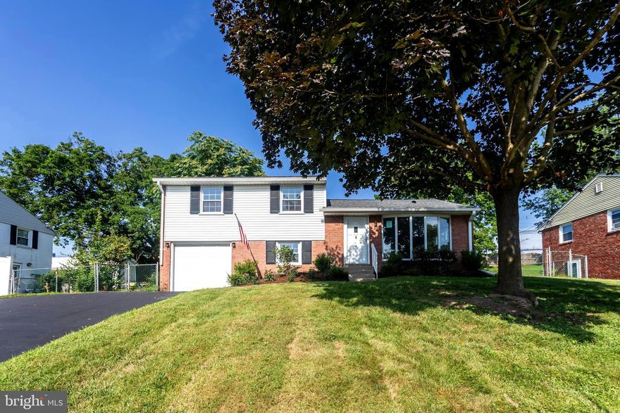 Welcome to Springfield with this beautiful 3/4 bedroom brick colonial in award-winning Springfield School District. This home is a split level with a modern open concept. The home features new central air and hardwood floors, an updated modern kitchen with granite counter tops, stainless steel appliances. The great room has a fireplace for those cold nights with sliding doors leading to the outdoor patio. Upstairs you will find 3 bedrooms and an a tastefully updated bathroom. An oversized double hall closet complements the second floor. There is walk-up access to a large attic with plenty of extra storage. This home boasts a large finished lower level with a full bathroom, access to the garage that can be used as a 4th  bedroom with its own entrance, laundry room and walk out to the screened porch. Finally, the large fenced in rear yard provides plenty of space for outdoor entertaining. Come see this wonderful Springfield home This beauty has been completely renovated and is ready for new owners. Close to major highways, restaurants, Springfield country club, and so much more.