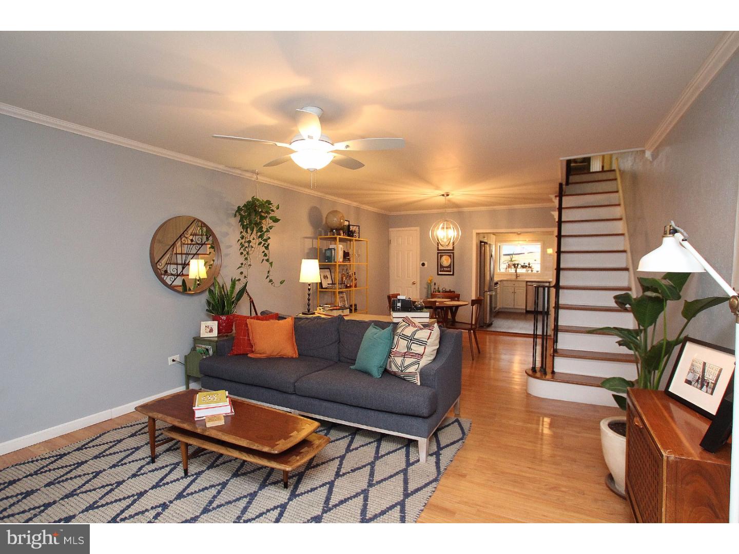 Who wouldn't want to live right off of one of Food & Wine's 10 Best Foodie Streets in America? And even if you're not interested in dining at any of the seven nearby spots that made Philly Mag's 50 Best Restaurants 2016 list, this stylish Passyunk Square house has plenty to offer on its own. The first floor has a great open floor plan, with ample room for separate designated living and dining areas without sacrificing flow, and there's a conveniently located powder room with ceramic tile floors and pedestal sink. The L-shaped kitchen is both pretty and functional, with tons of clean white cabinetry, open shelving and the cutest built-in pantry; stainless steel appliances, including a GE range and Whirlpool refrigerator with bottom-drawer freezer; and crisp mint walls accented by a white subway tile backsplash. Over the sink there's a large greenhouse window overlooking the awesome rear patio. This is not your typical South Philly "backyard," aka a mini concrete slab; this outdoor area has tons of space for a table, a grill AND a container garden and also has breezeway access for bikes and trash cans. Up on the second floor, the sunny master bedroom has a huge closet and pretty original wood floors that continue throughout the second level. The middle bedroom, currently used as a workspace, has an awesome cork accent wall, white beadboard walls and a picture rail used for a clever lighting solution. The rear bedroom has another big closet with built-in shelving, and the hall bath features a granite-topped vanity with sea glass vessel sink and ceramic tile shower surround. In addition to being around the corner from all the bars, shops and restaurants Passyunk Ave has to offer, you're also a short walk to the Broad Street line for easy access to Center City. But once you get settled in this neighborhood, you probably won't want (or need!) to leave much.