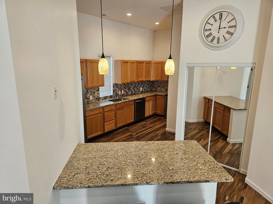 Must See!! 2 bedroom 2bath roommate style condo (Converted  Garage) . Recently renovated and painted throughout. The large kitchen features energy efficient stainless steel appliances granite countertops and beautiful tile backsplash. It also includes a deep sink with instant hot water dispenser.  Beautiful hardwood tile floors throughout main living areas and carpeted bedrooms. Bedrooms are large and feature modern style ceiling fans and energy efficient windows.  Your new home includes private driveway and access to the large outdoor space in addition to storage shed. Schedule your appointment today as this property will not be on the market long.