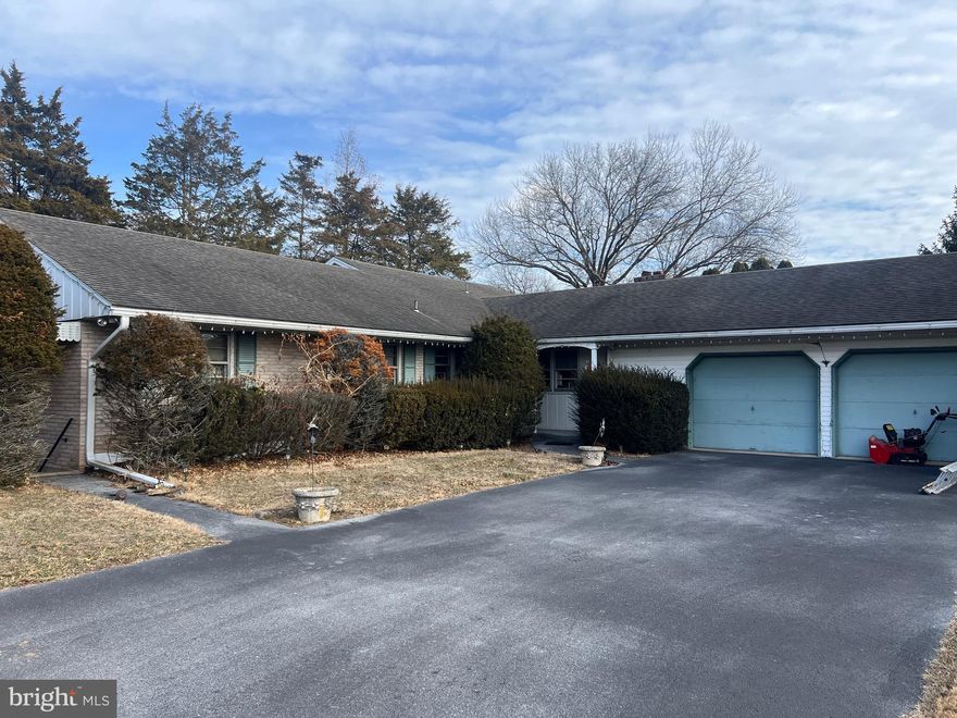 They don’t build them like this anymore! This sprawling 4-bedroom, 2-bath ranch home in Exeter Township offers solid construction, generous space, and a peaceful country setting with the home set back from the highway for added privacy.

With 2,732 sq. ft. of living space (per tax records), there’s plenty of room to spread out. The property features an oversized 2-car garage with a workshop area, plus a standout covered side porch—perfect for relaxing or hosting outdoor gatherings rain or shine.

A large portion of the basement has been finished and was previously used as a dance studio, complete with its own private outside entrance to the driveway. This space offers great flexibility for a home office, recreation room, studio, or multi-purpose living area.

Please note: This home has considerable deferred maintenance and will require repairs and updates, some of which may need immediate attention. However, the structure is strong and the home presents an excellent opportunity for the right buyer to restore and customize it.

Additional highlights include 200-amp electrical service, sub-panels in the basement workshop, and oil heat. The county’s assessed market value is just under $500,000, and the home has been priced accordingly to reflect the work needed. The seller will make no repairs or improvements. Bring your vision and your toolbox—this one has the space and potential to truly shine.