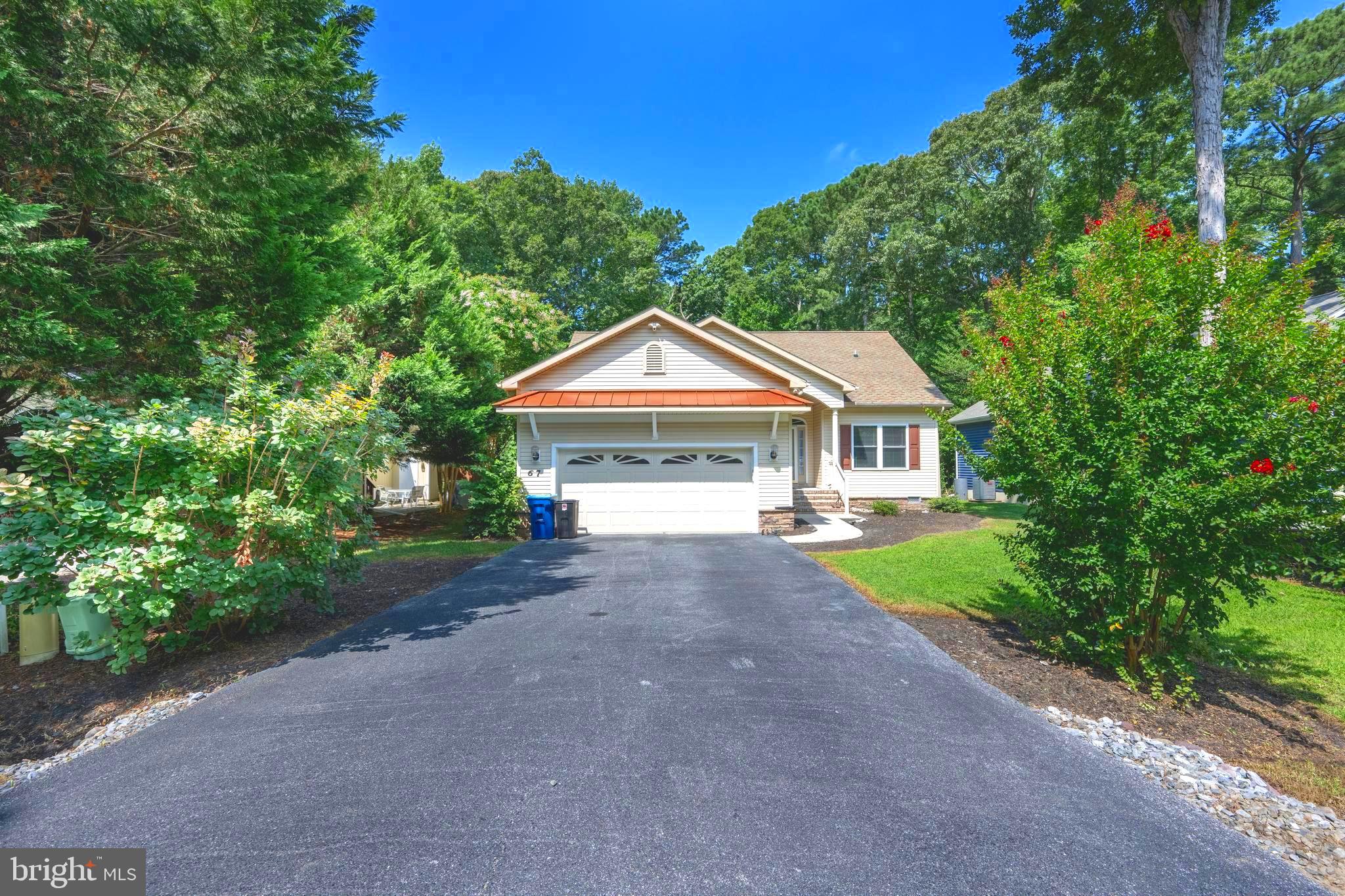 Immaculate Ocean Pines Retreat – Just 10 Minutes from Ocean City Beaches! This single-level home makes everyday living easy, whether you’re here full-time or looking for the perfect vacation spot. The open floor plan features a spacious Florida room that looks out over a very private yard—great for kids, pets, or simply relaxing with a coffee in the morning. Inside, you’ll love the bright, open feel with soaring ceilings, hardwood floors, and big windows that let in tons of natural light. The kitchen is fully updated with top-of-the-line appliances and finishes, and the spa-like bathrooms offer a peaceful retreat. Other highlights include a cozy gas fireplace, large rooms, a 2-car garage with epoxy flooring, irrigation system, encapsulated crawlspace, and beautiful landscaping all around. Living in Ocean Pines means you get access to a ton of awesome amenities—like a private beachfront restaurant in Ocean City, a public yacht club and two marinas, five pools, a top-notch racquet sports complex, and a championship golf course designed by Robert Trent Jones Sr. Whether you’re looking for comfort, convenience, or just a great place to unwind, this home checks all the boxes.