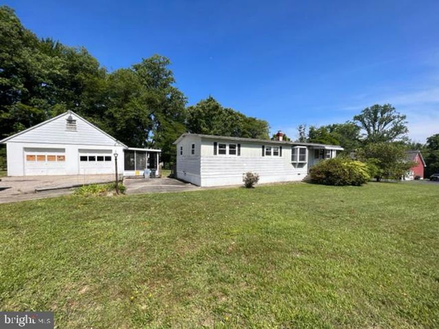 Fantastic Opportunity!  Bring your hammer and take advantage of an affordable home on a half acre of flat property with a 2 car detached garage.  Plenty of parking spaces- roof 2012, septic installed 2018, woodburning fireplace, spacious kitchen, a corner lot with a plenty of space to grow!  Enjoy the peacefulness of your corner lot in your screened area combined with a large deck that spans the entire rear of the home.  The 2 car detached garage boasts an additional screened in bonus area and a  finished loft that was once used as a fourth bedroom and a woodburning stove to keep the winter nights warm.   Stackable washer/dryer, and all other appliances convey.  Live here and renovate or enjoy the vintage feel of yesteryear!