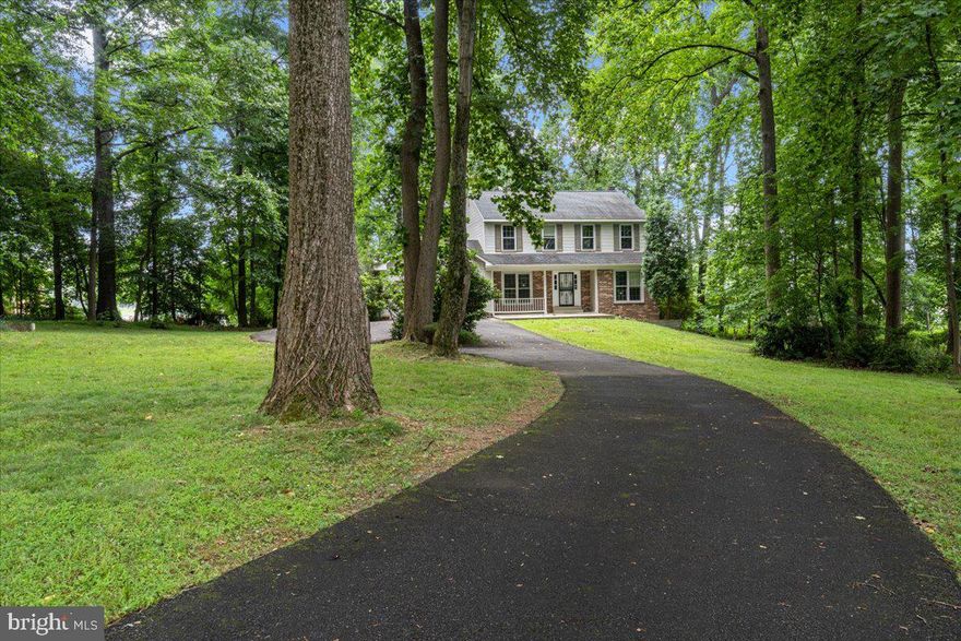 Amazing opportunity to purchase a fixer-upper and make it your own! Spectacular location, just minutes to Leesburg Pike, shops, restaurants and parks. The home is set back from the road and sits on almost an acre of  beautiful woods and mature trees.  Inside there are hardwood floors in the foyer, formal living room room, formal dining room and in the fireplaced family room. Open concept great room with kitchen, dining area and family room is perfect for entertaining. 4 spacious bedrooms on the second floor, one being the master with a generously sized master bathroom. The unfinished basement offers endless possibilities for additional living space and storage.