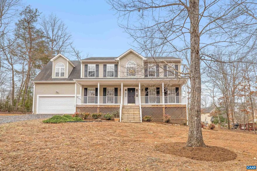 This stunning 4-bedroom, 2.5-bath home in Lake Monticello offers 2,385 finished sq ft and a 2-car garage. The light-filled first floor boasts gleaming hardwood floors, a dining room, a spacious living room with a gas fireplace, a convenient half bath, and laundry. The eat-in kitchen features a center island and a bay window overlooking a sunny back deck, perfect for enjoying outdoor meals. Upstairs, the large primary bedroom includes an en-suite bath, walk-in closet, and vaulted ceilings, while three additional generously sized bedrooms share a full bathroom. Relax on the rocking chair front porch or unwind on the back deck, overlooking the large backyard. The home is ideally situated just outside the main gate and is only 20 minutes from Pantops. Residents of Lake Monticello enjoy access to a range of amenities, including a lake, golf course, tennis courts, playgrounds, and more.,Formica Counter,Oak Cabinets,Fireplace in Living Room