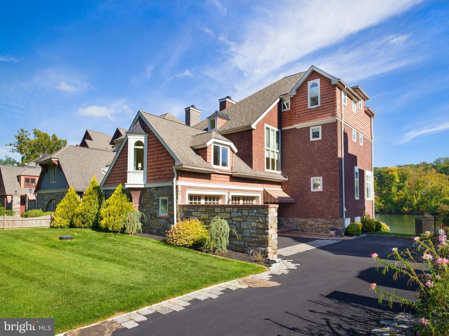 Riverfront Living Redefined in Gladwyne. Set directly on the Schuylkill River, this exceptional 4-bedroom, 4.5-bath home offers a lifestyle unlike any other on the Main Line—where mornings begin with sunlight glinting off the water and days unfold effortlessly kayaking, boating, water-skiing, wakeboarding, or simply relaxing along the river’s edge. Designed for those who crave connection to nature without sacrificing proximity to the city, this residence captures the rare serenity of waterfront living just minutes from Gladwyne Village and Center City Philadelphia.

Inside, 10-foot ceilings, expansive windows, and gleaming hardwood floors create a sense of openness and light. The gourmet kitchen features floor-to-ceiling cabinetry, granite countertops, a large center island, and high-end stainless-steel appliances—perfectly suited for both quiet mornings and lively gatherings. The main living areas flow seamlessly to outdoor terraces and decks, framing stunning river views at every turn.

Each bedroom is spacious and tranquil, with beautifully finished baths throughout. A dedicated boat room provides convenience and storage, complementing the private dock that anchors this true riverfront retreat.

Few homes offer such an intimate connection to the water—and even fewer combine it with timeless architecture, modern comfort, and the prestige of a Gladwyne address.