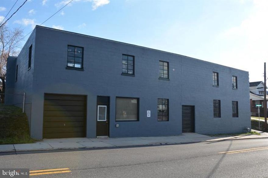 This versatile commercial property offers nearly 13,000 square feet of usable space, ideal for a wide range of business needs. Once utilized as an office, sheet metal fabrication, and warehouse for a local plumbing and heating business, the building features two floors, two bathrooms, and three convenient drive-in doors. Situated on a corner lot, the property boasts a roof installed in 2021. With its flexible layout and strategic location, this property presents endless possibilities for businesses looking to get started or expand.